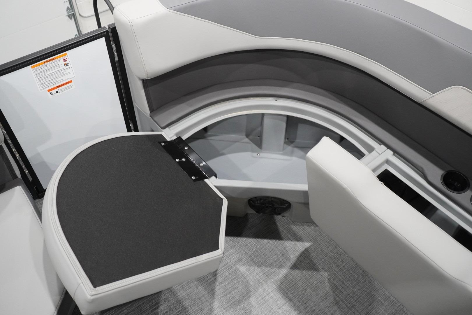 Interior seating and storage of 2026 Lowe LS 190 boat, featuring gray upholstery.