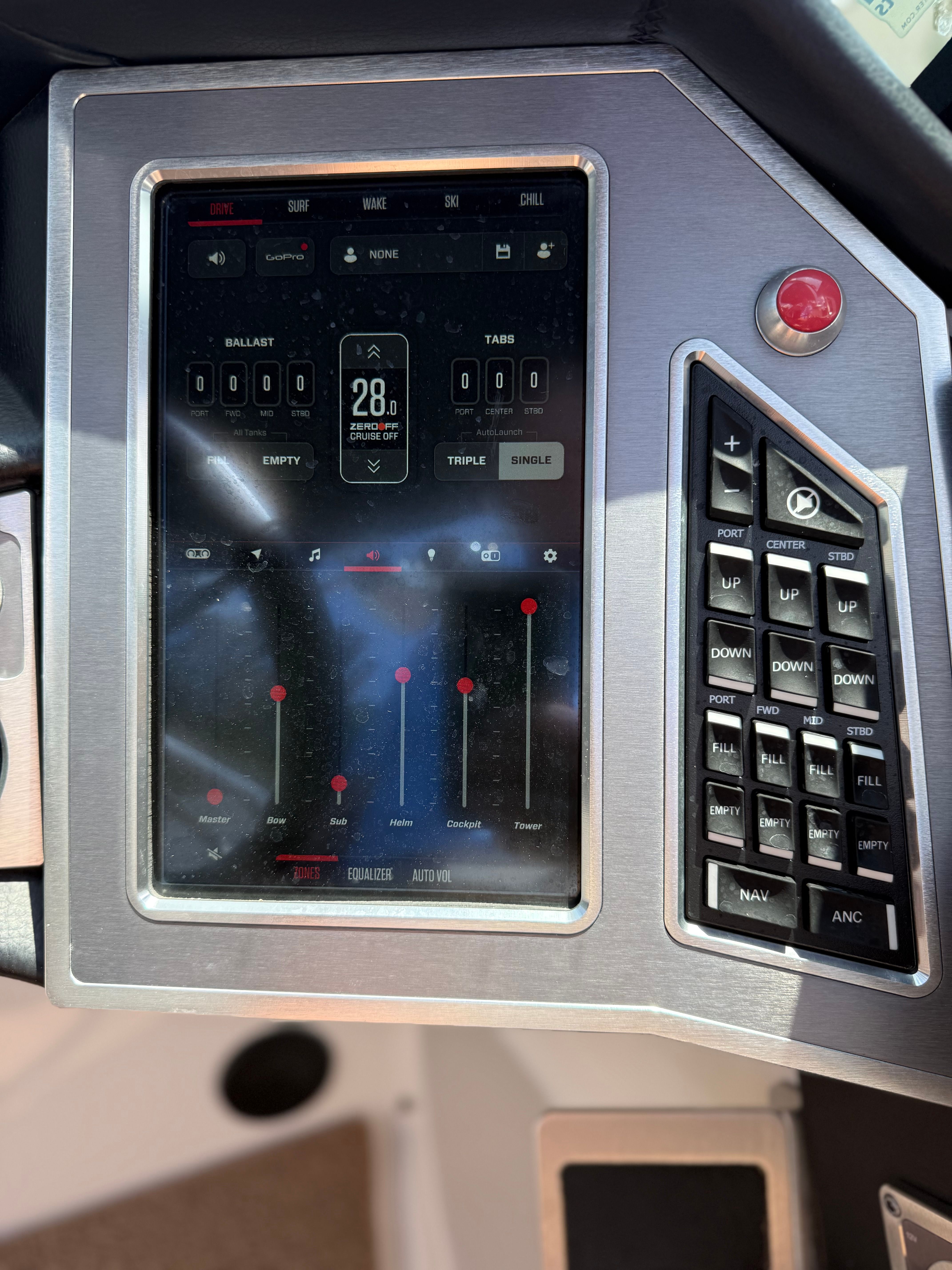 Dashboard of a MasterCraft X24 boat featuring a touchscreen and controls.