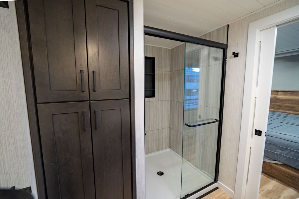 Interior of a 1999 Sumerset Widebody with shower and cabinet.