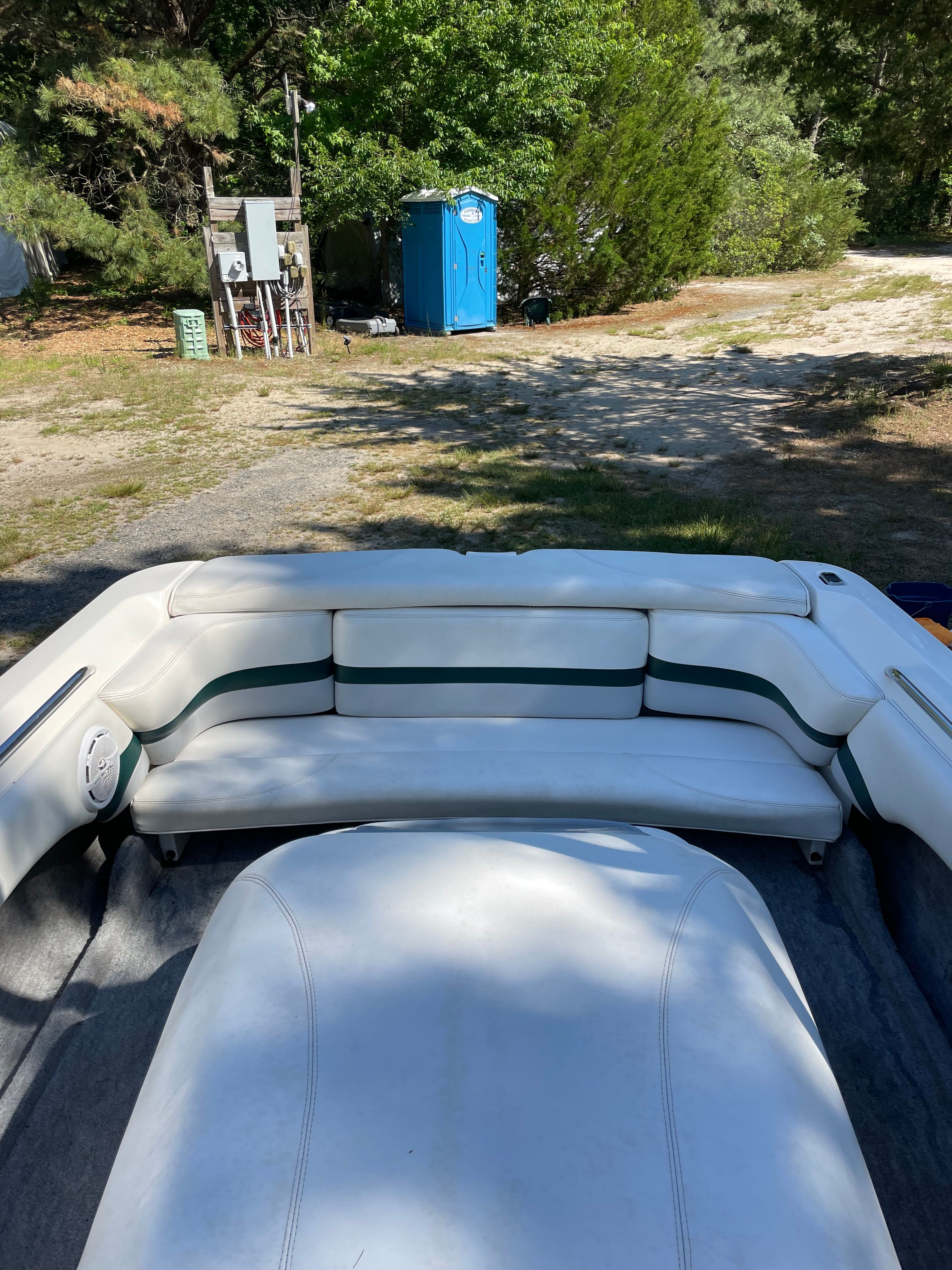 Interior of a 1997 MasterCraft Prostar 205 boat, parked on land.