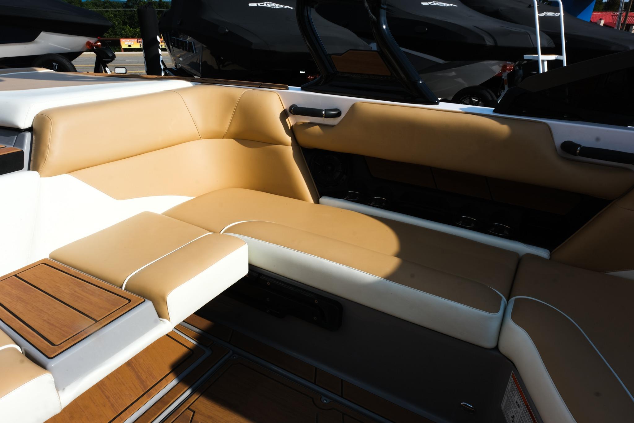 2023 Moomba Mondo boat interior with tan and white seating, showcasing luxury design.