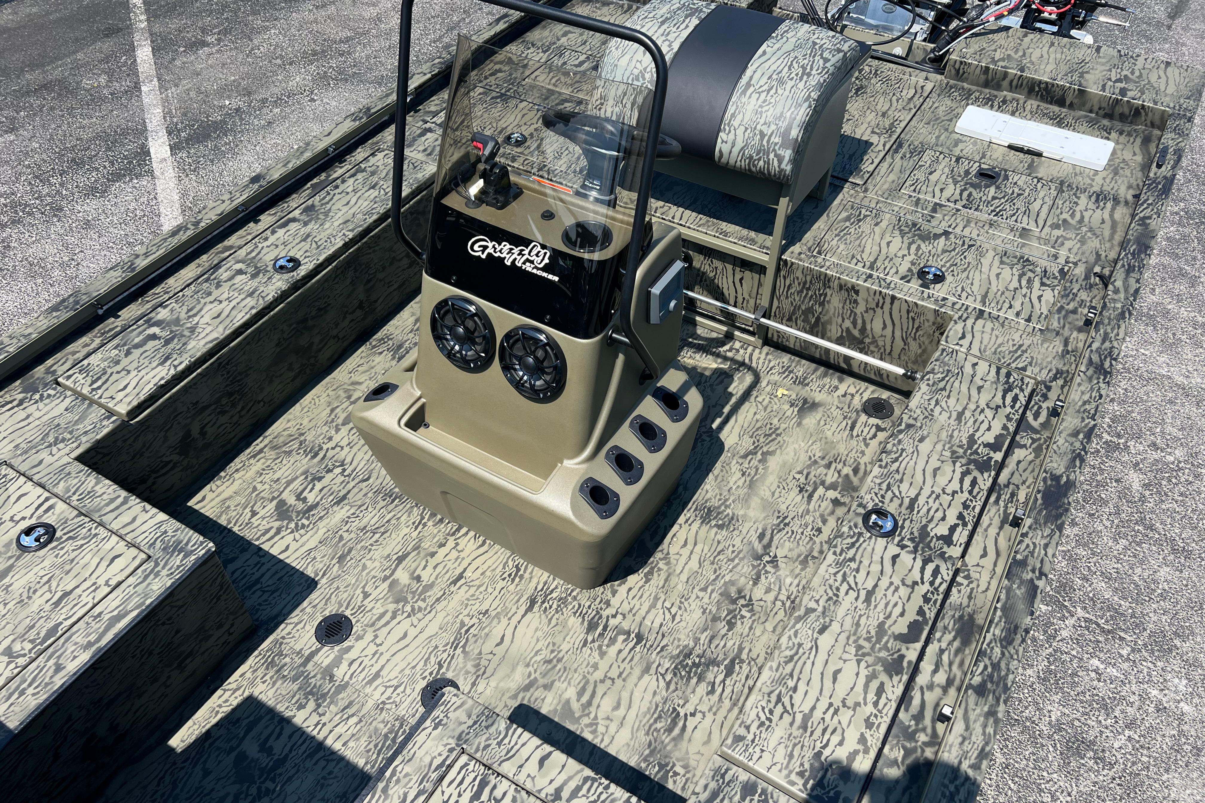 2026 Tracker Grizzly 2072 CC Sportsman Kicker boat interior with camouflage design.
