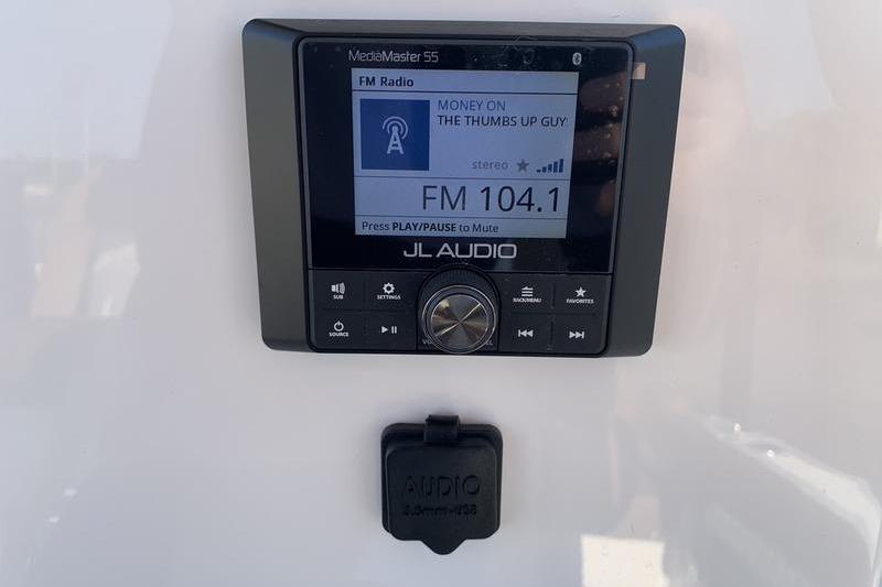 JL Audio MediaMaster 55 radio display on Pioneer ISLANDER 202, 2026 model.