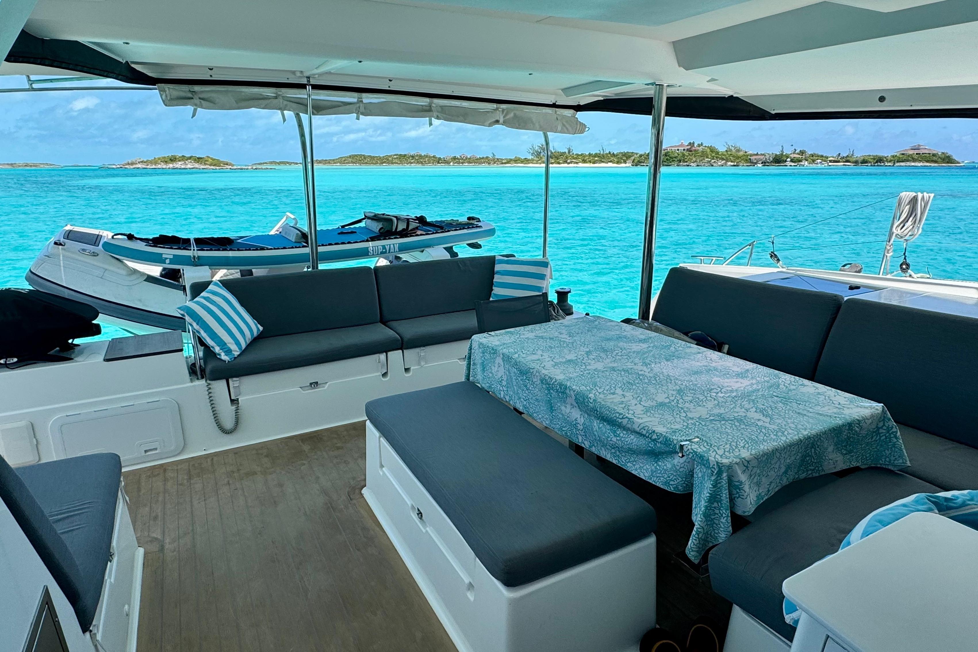 Luxurious 2020 Fountaine Pajot Saona 47 catamaran interior with stunning turquoise sea view.
