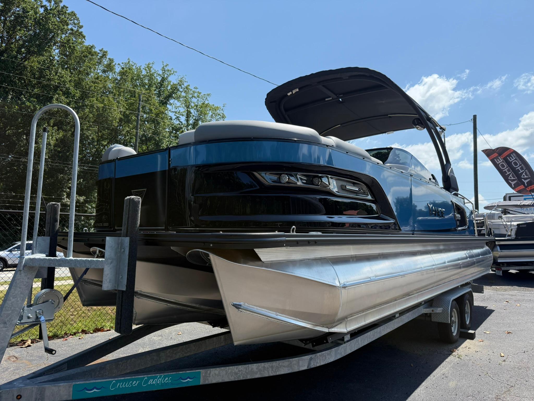 2025 Tahoe Pontoon Grand Tahoe Elite Windshield on trailer, sunny day, outdoor display.