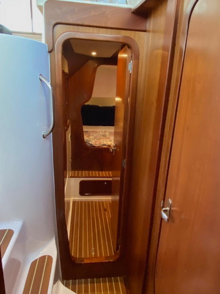 2013 Africat Marine PowerCat Sportfisher interior with wooden finishes and cabin view.