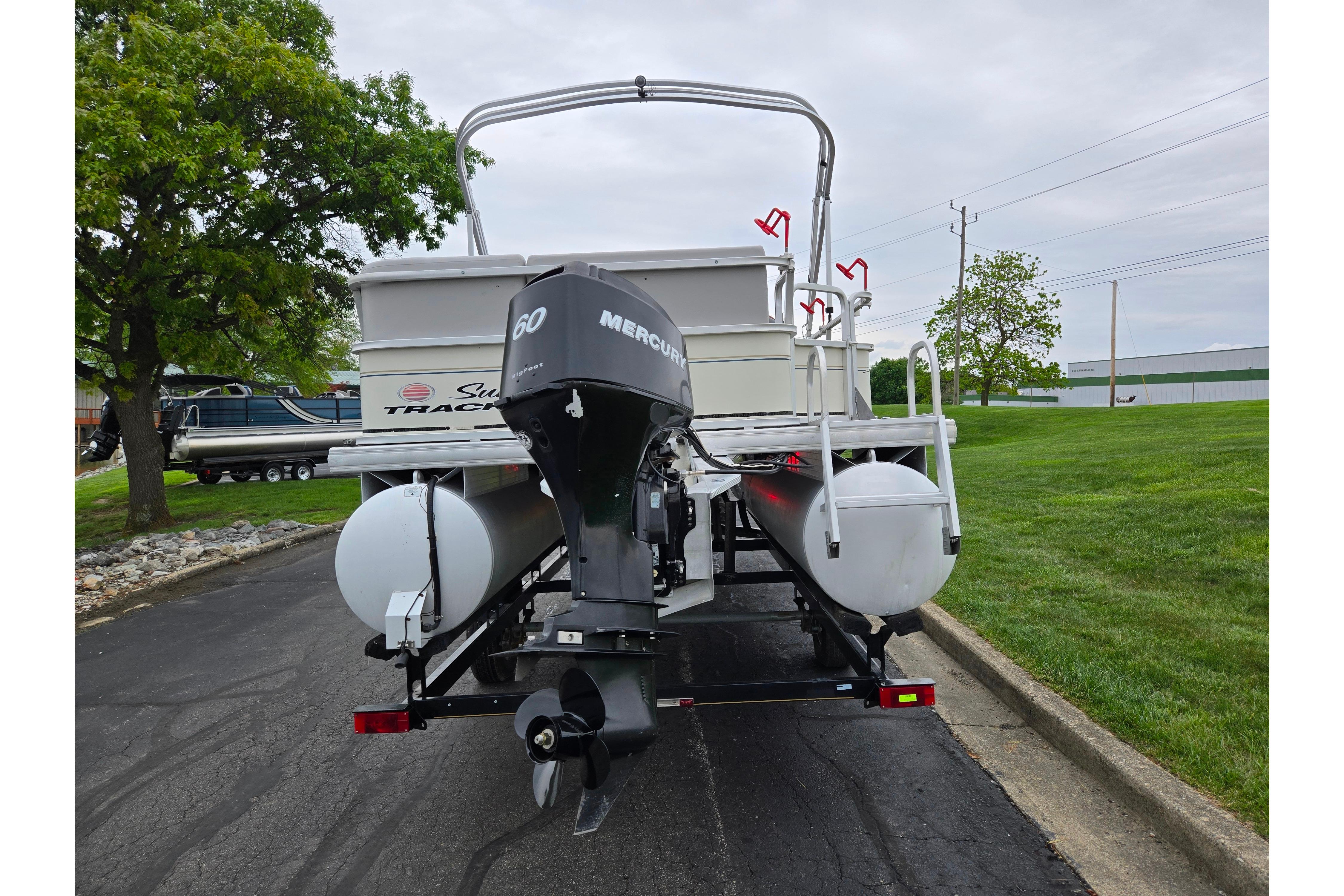 2008 Sun Tracker Fishin' Barge 21 Signature Series with Mercury 60 engine on trailer.
