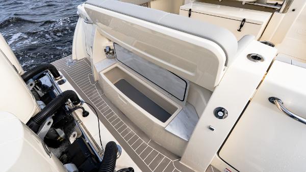 2025 Scout 425 LXF boat with open storage compartment on deck.