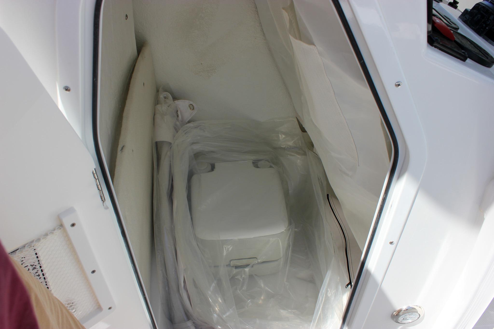 Interior storage compartment of 2027 Sea Hunt Ultra 234 boat.