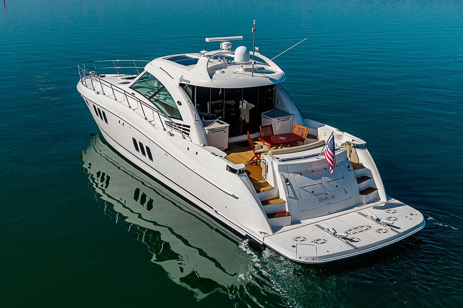 2008 Sea Ray 60 Sundancer yacht cruising on calm blue waters.