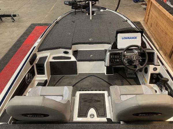 2025 Triton 20XP boat interior with steering wheel, seats, and Lowrance electronics.
