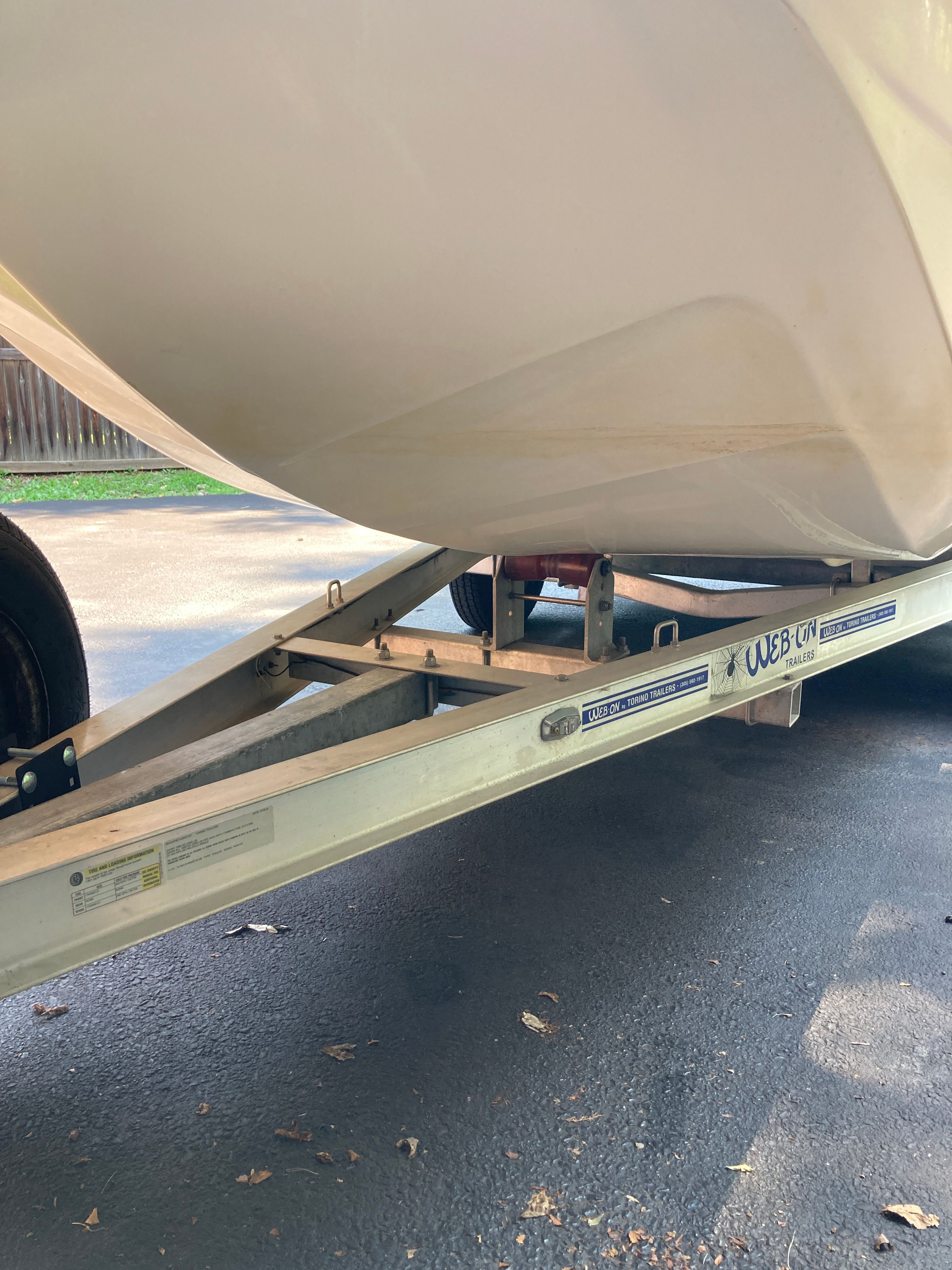 A 2012 Carolina Skiff JVX16CC on a trailer, ready for transport.