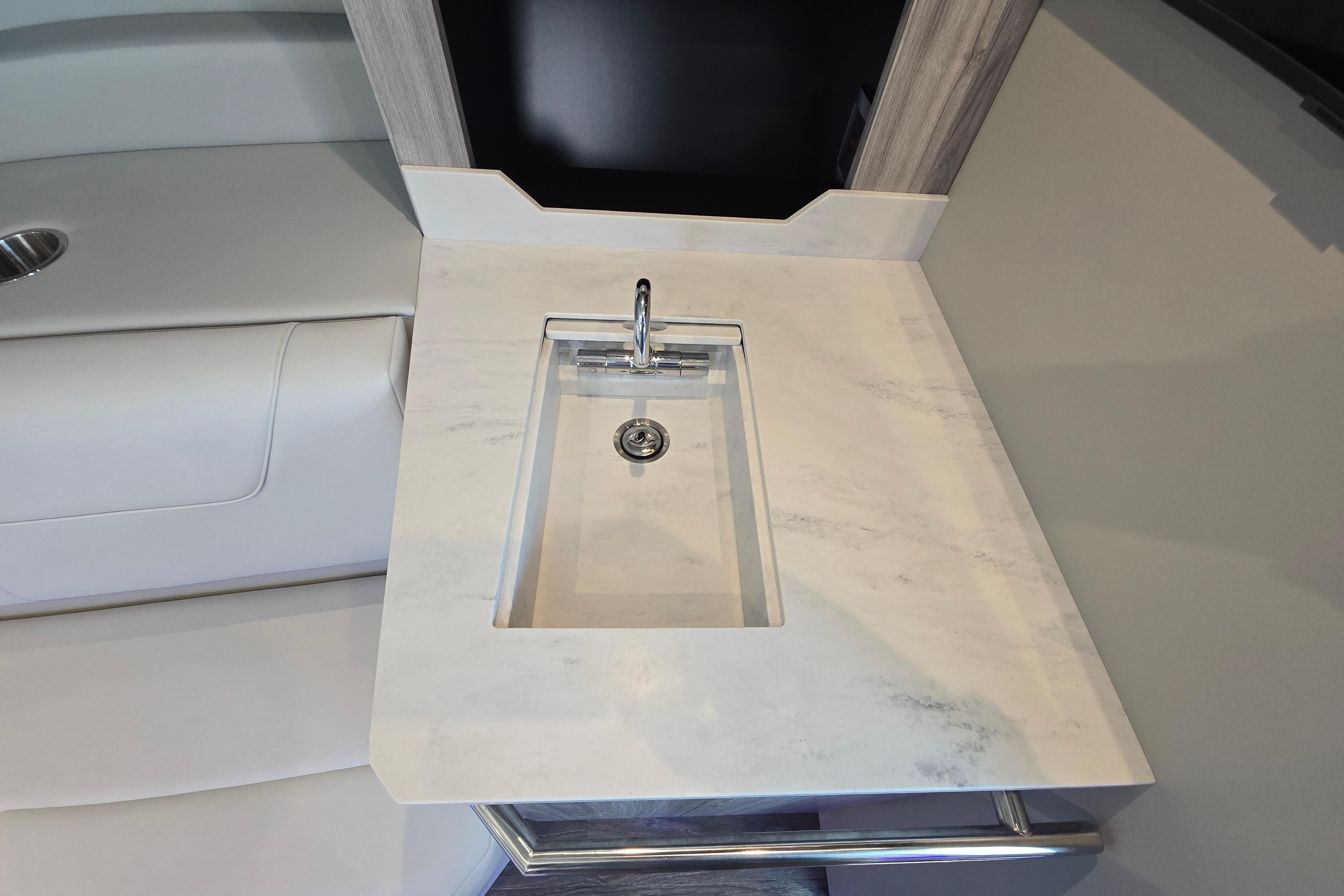 Modern sink area in 2025 Formula 380 Super Sport Crossover OB boat interior.