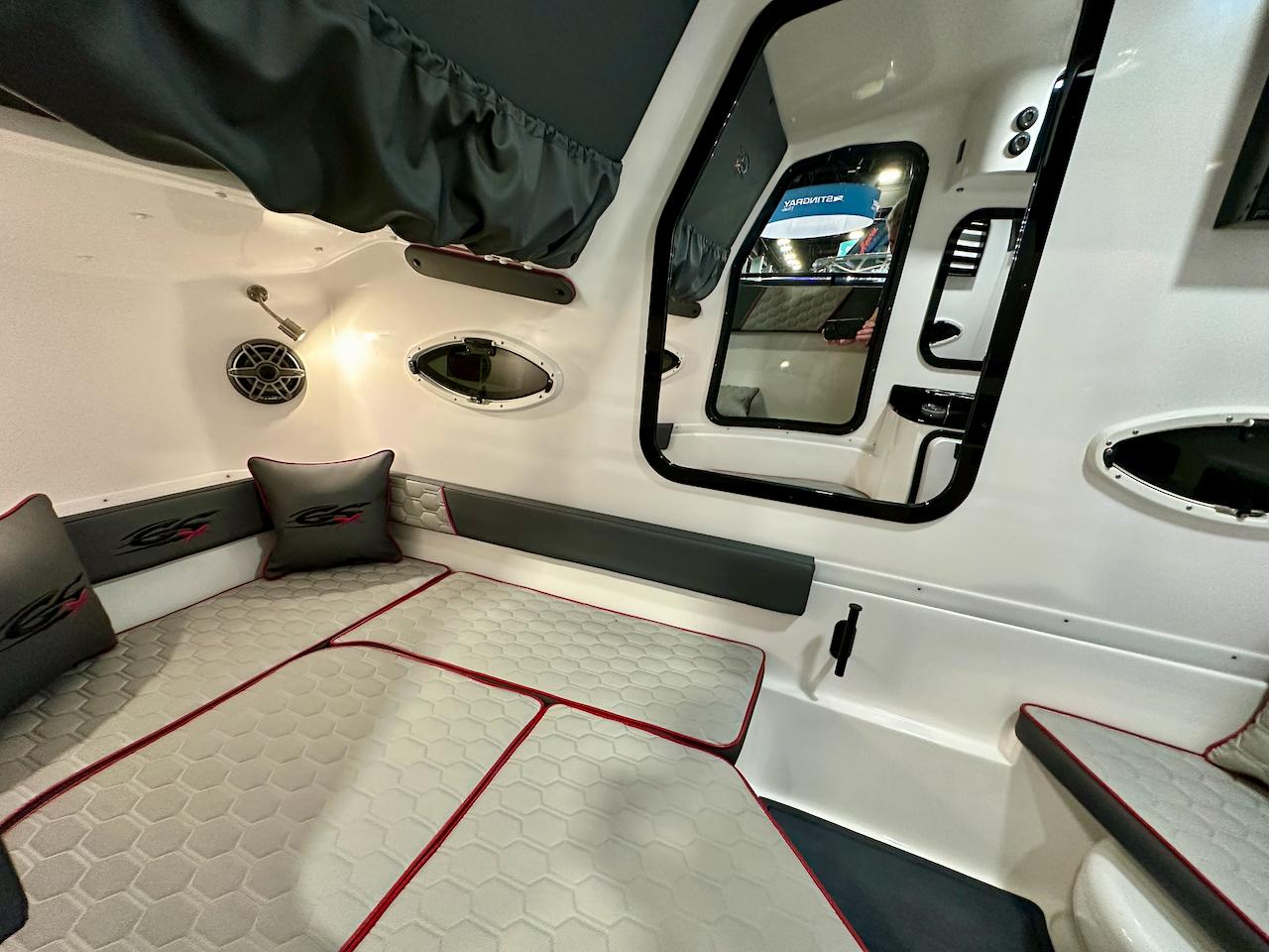 2024 Glasstream 36 GSX cabin interior with modern seating and portholes.