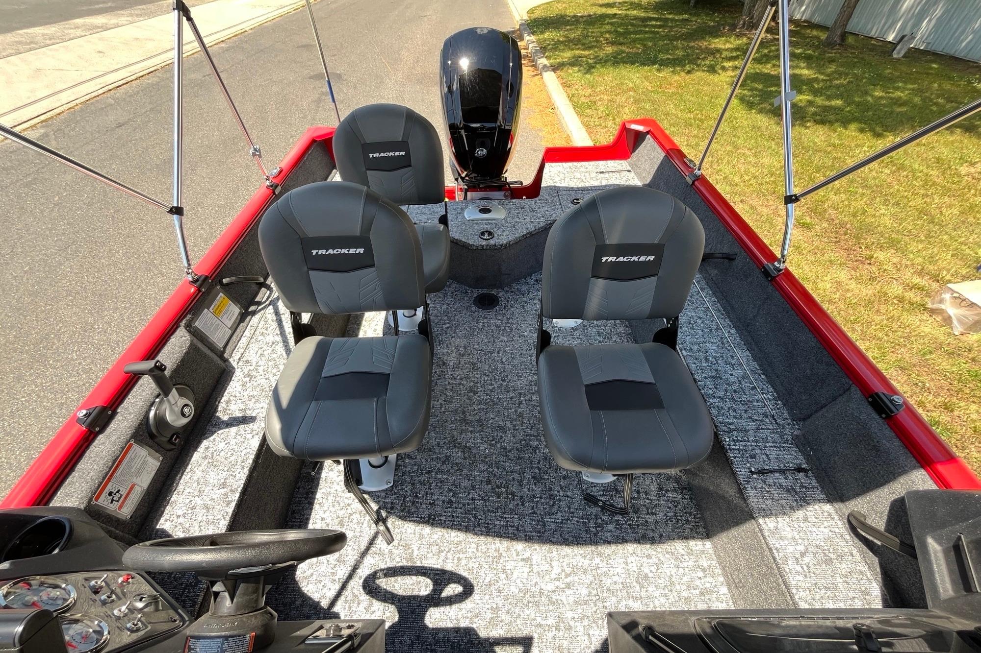 2026 Tracker Pro Guide V-16 WT boat interior with four seats and steering console.
