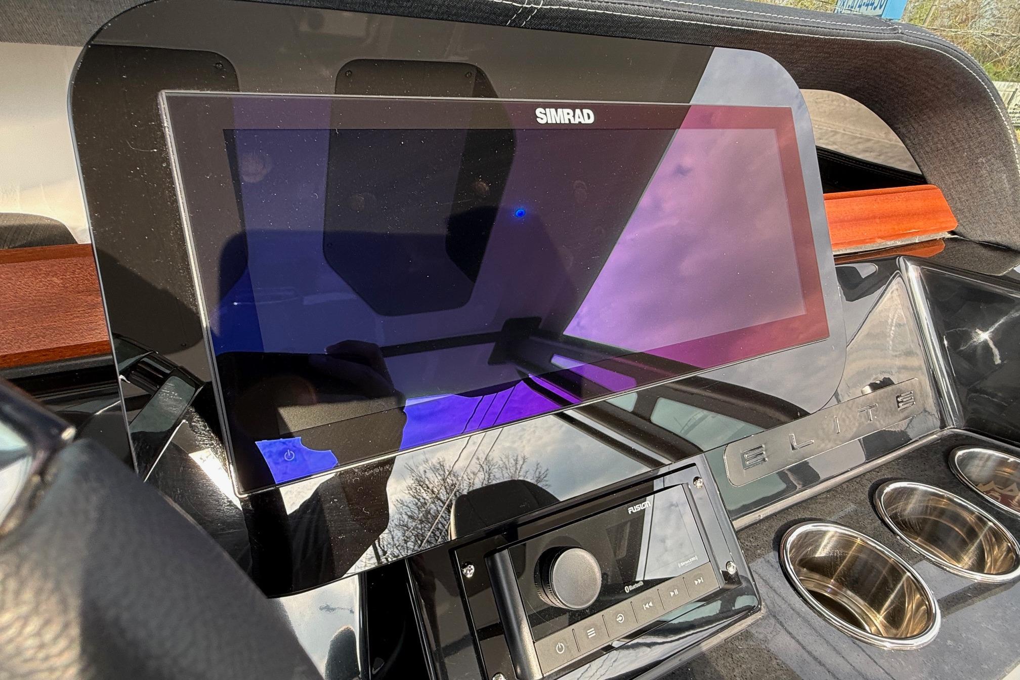Dashboard of 2026 Monterey Elite 25 OB boat with Simrad display and controls.