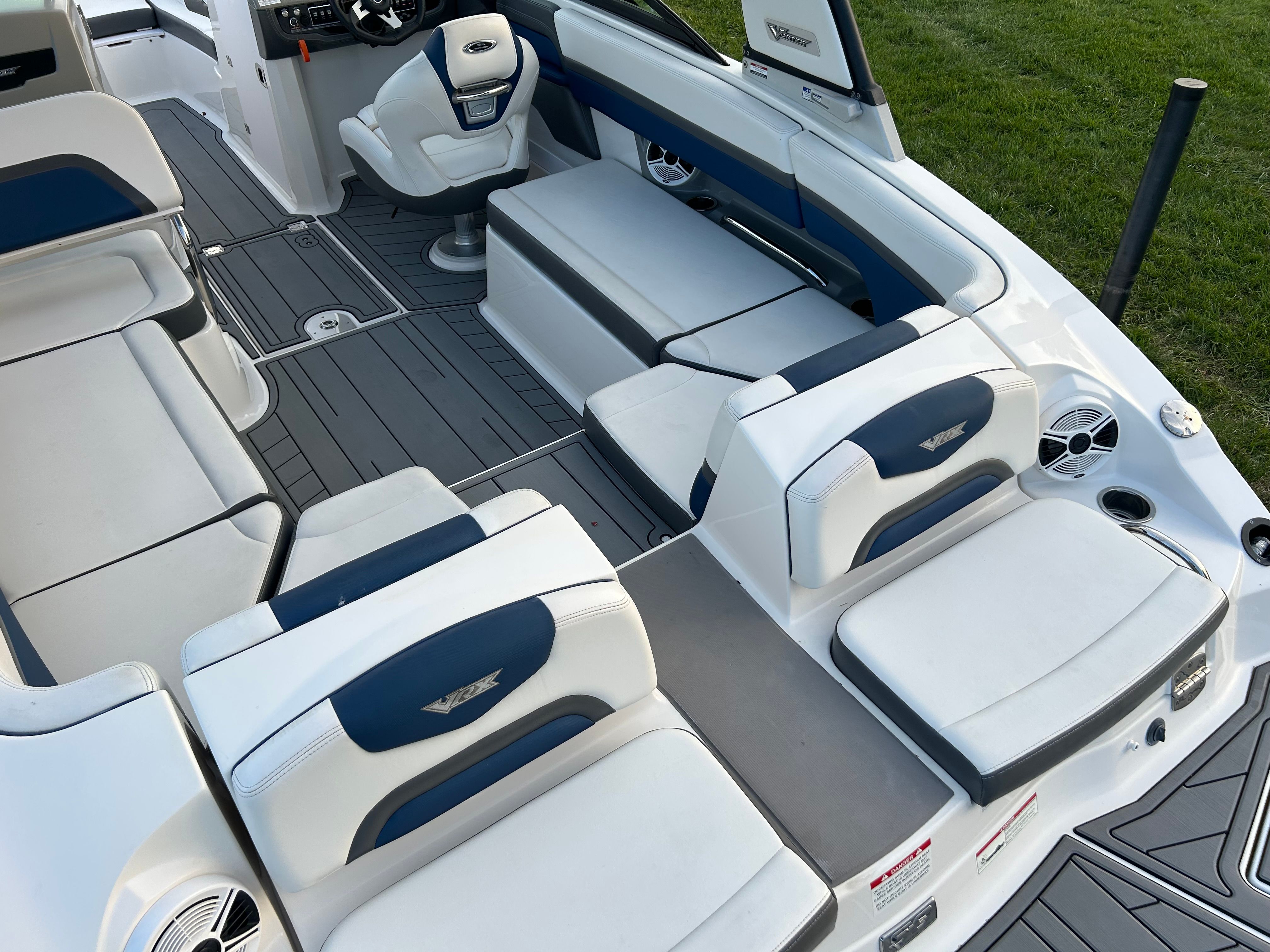 Interior of a 2015 Chaparral Vortex 243 VRX boat with luxurious seating.