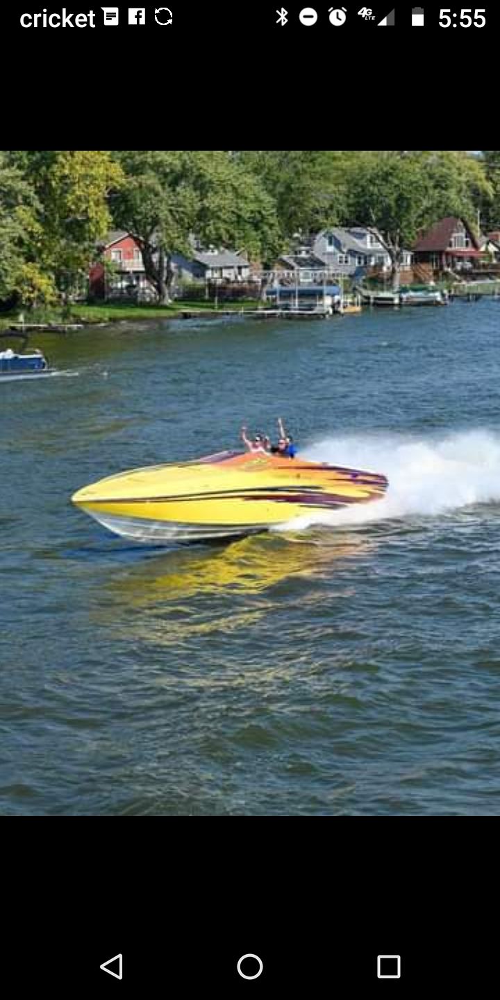 2006 Active Thunder Offshore boat cruising on a river.