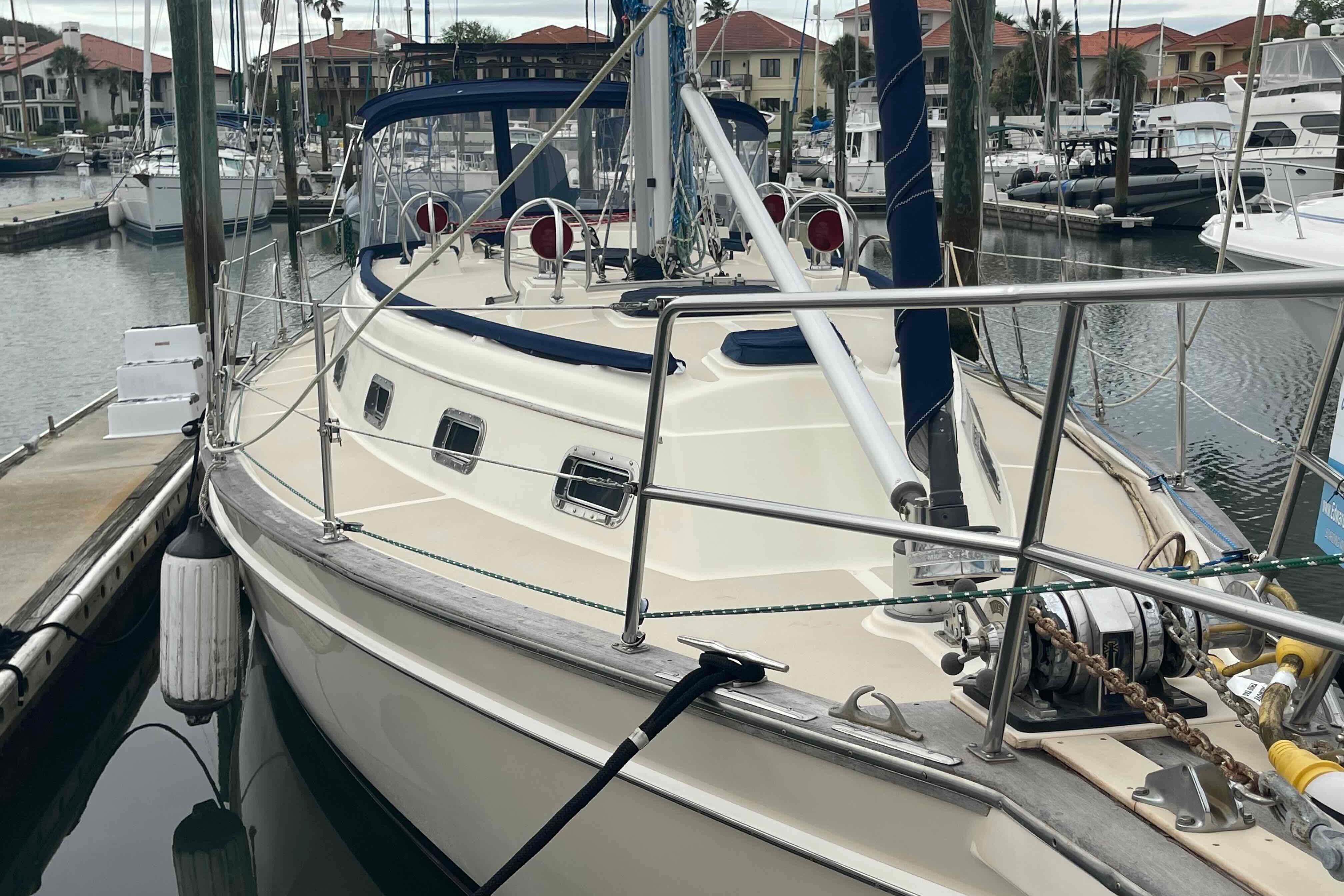 1998 Island Packet 40 sailboat docked in a marina, showcasing its deck and rigging.