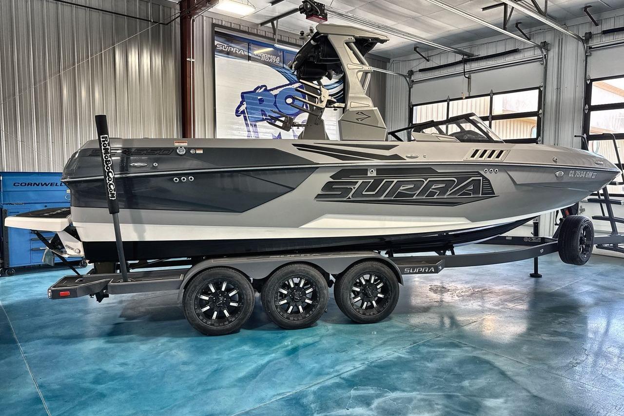 2021 Supra SE 550 boat on trailer in a garage setting.