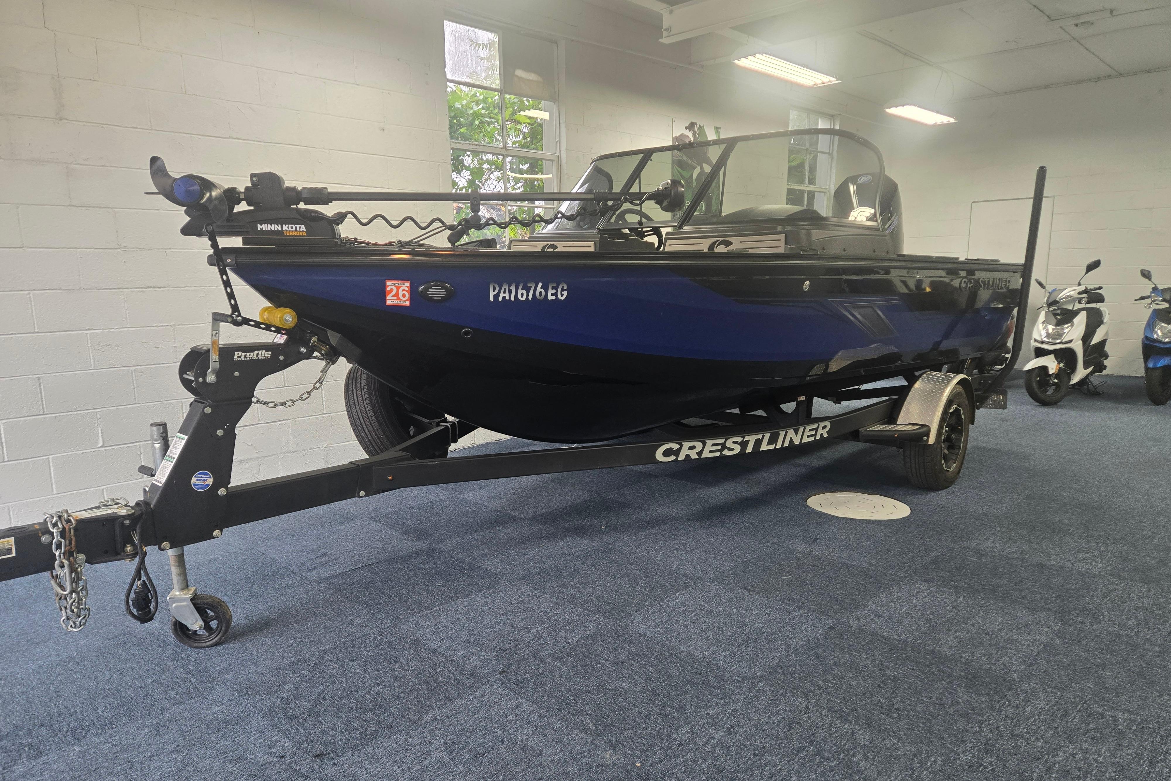 2020 Crestliner 1850 Raptor WT boat on trailer in indoor showroom.