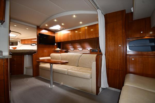 Luxurious interior of 2010 Cruisers Yachts 390 Sports Coupe with elegant wood finish.