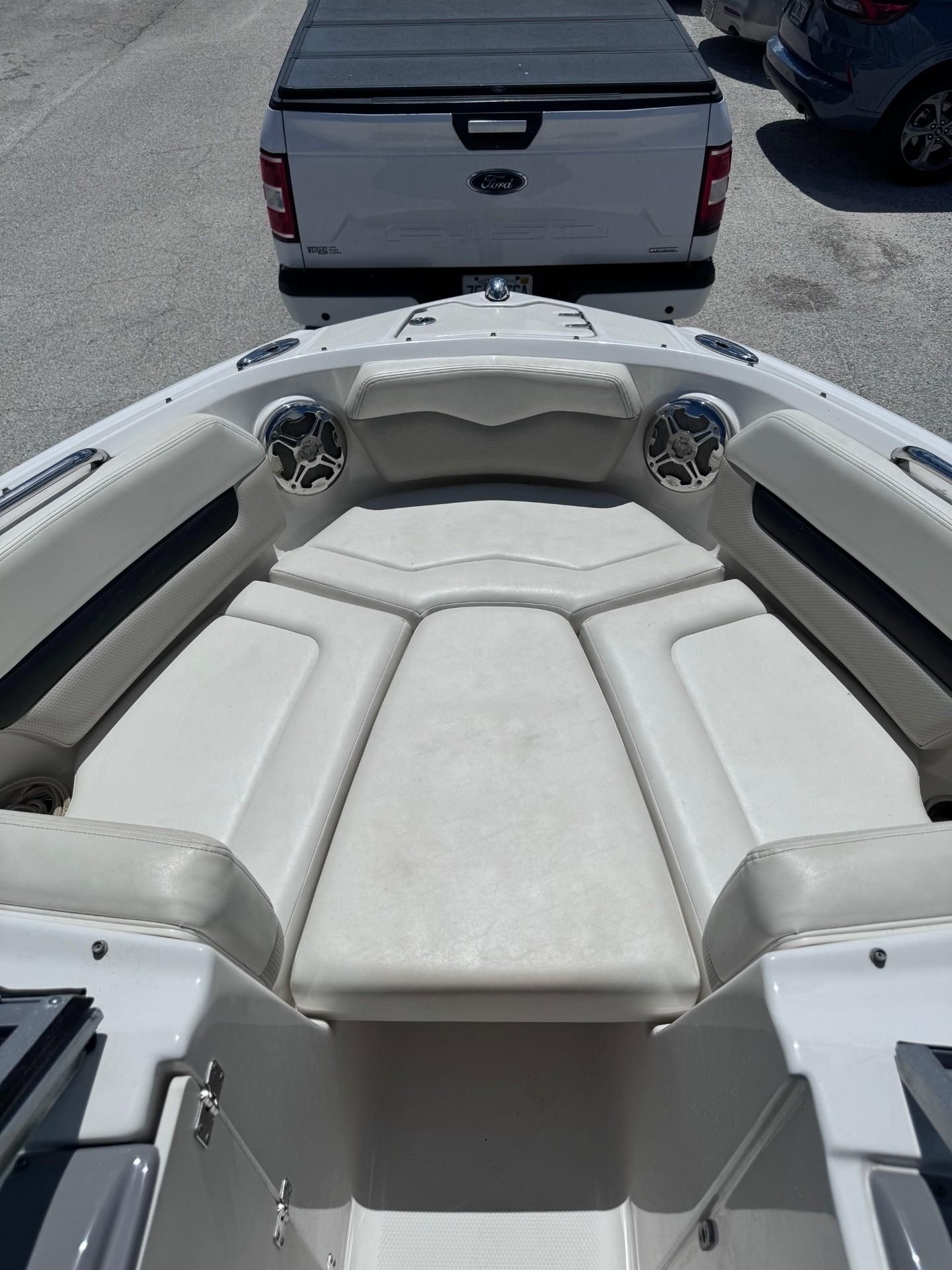 The image shows the bow area of a Chaparral 206 SSi boat with cushioned seating.
