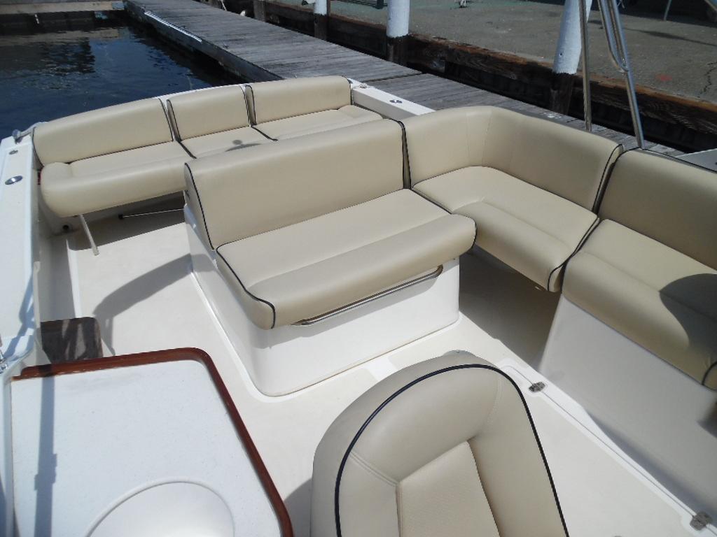 Interior of a 2006 Hunt Yachts Harrier 25 with beige seating.