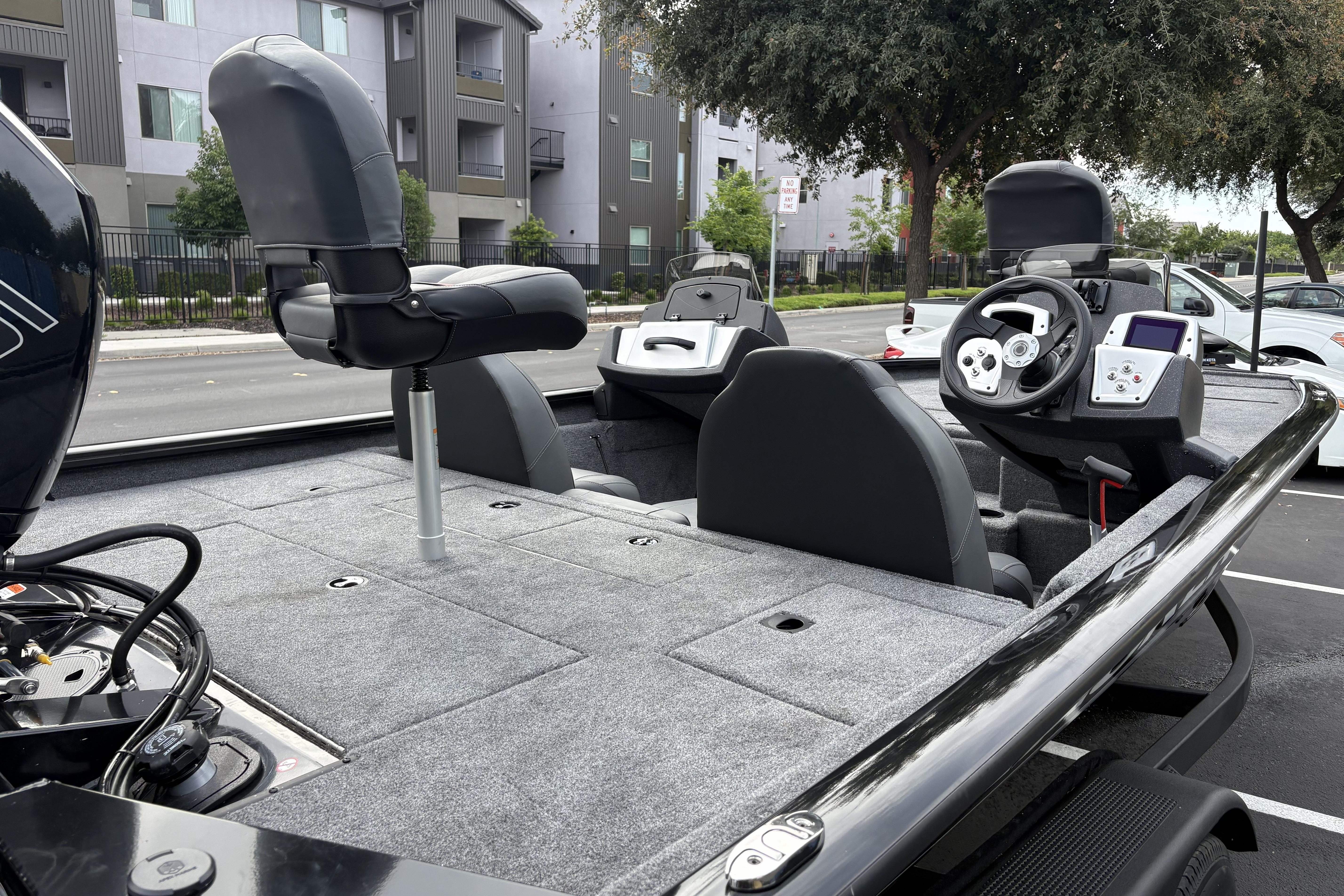 2026 Tracker Pro Team 195 boat interior with seating and steering console.