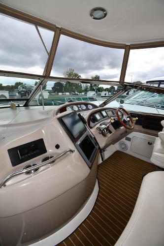 2003 Sea Ray 460 Sundancer helm with modern controls and panoramic windows.