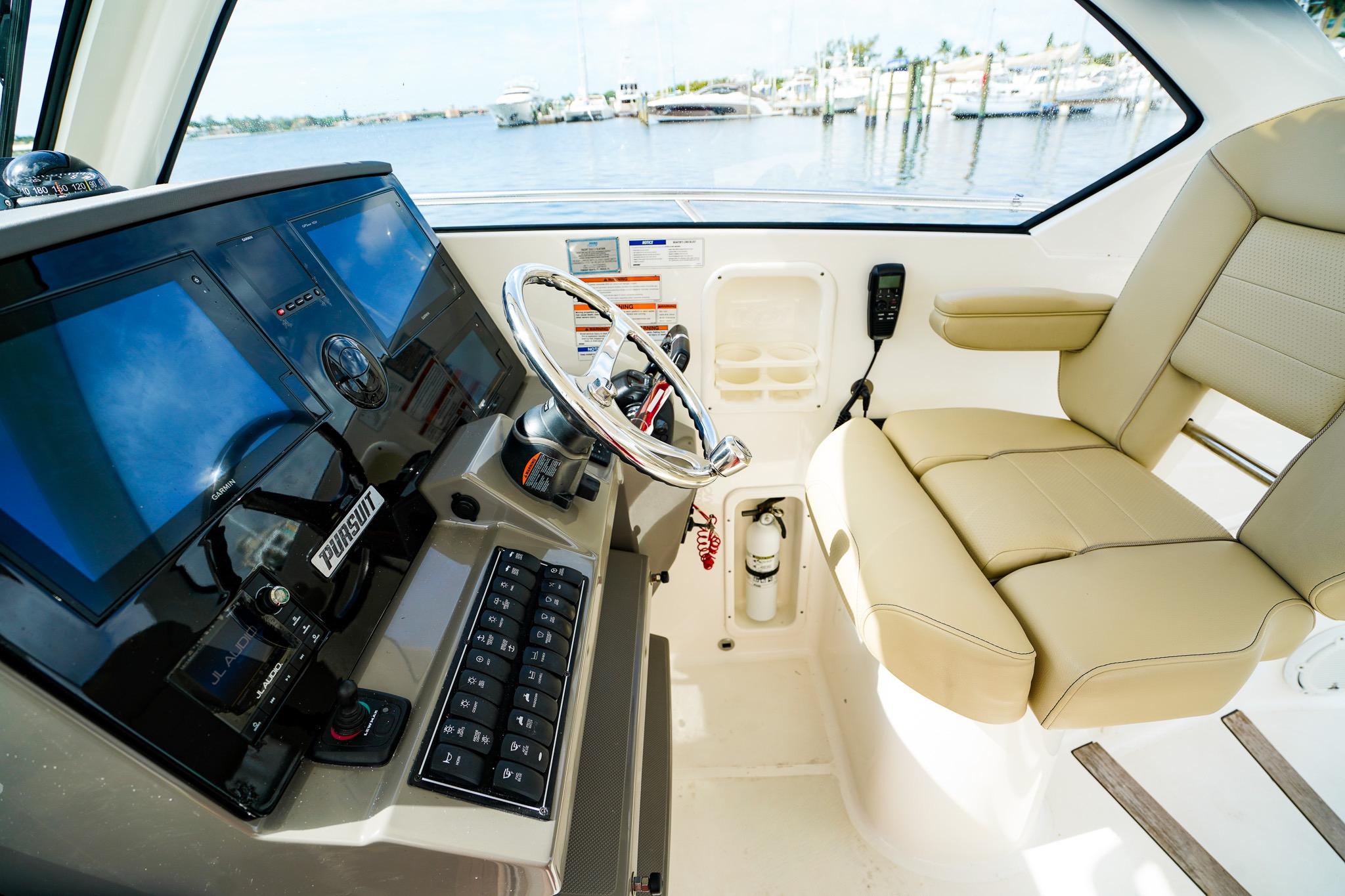 2020 Pursuit OS 325 Offshore helm with modern controls and comfortable seating.