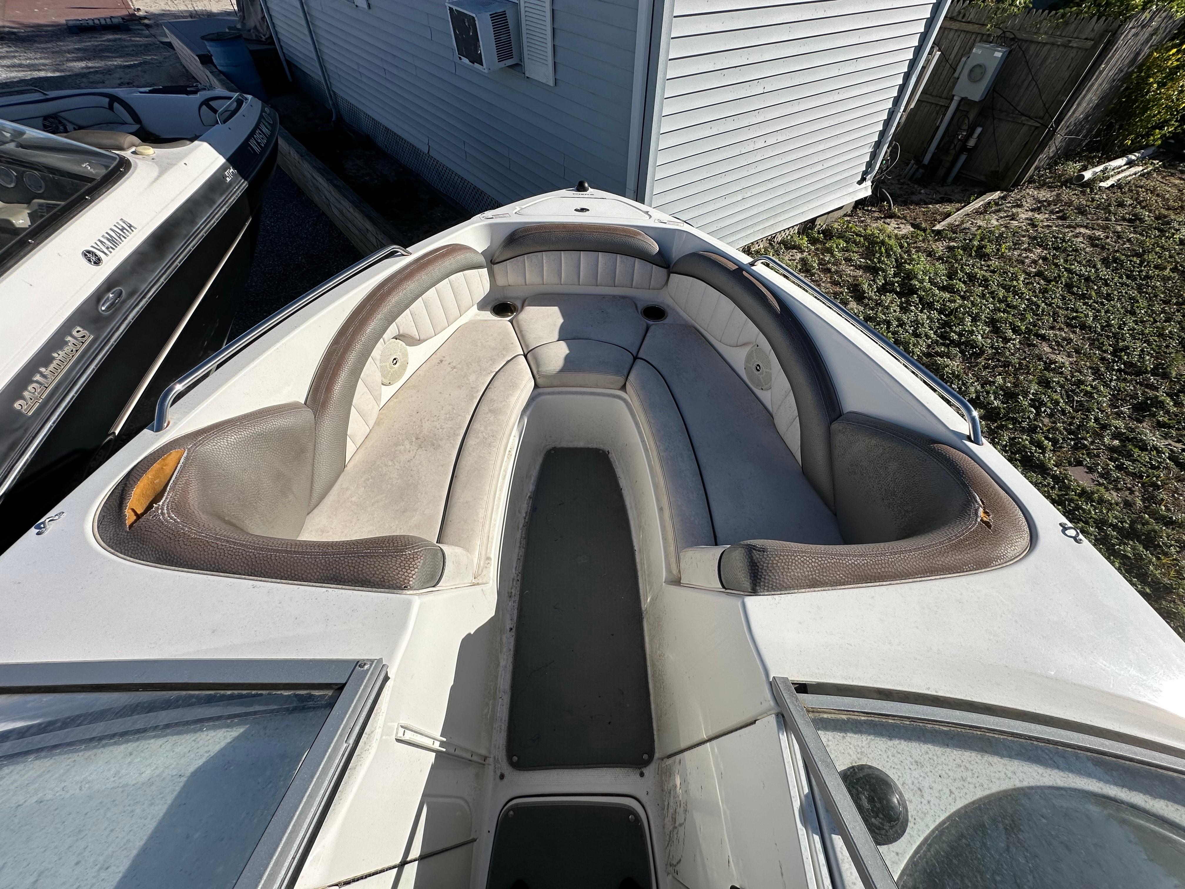 2008 Yamaha Boats SX230 bow seating area with cushioned seats and storage compartments.