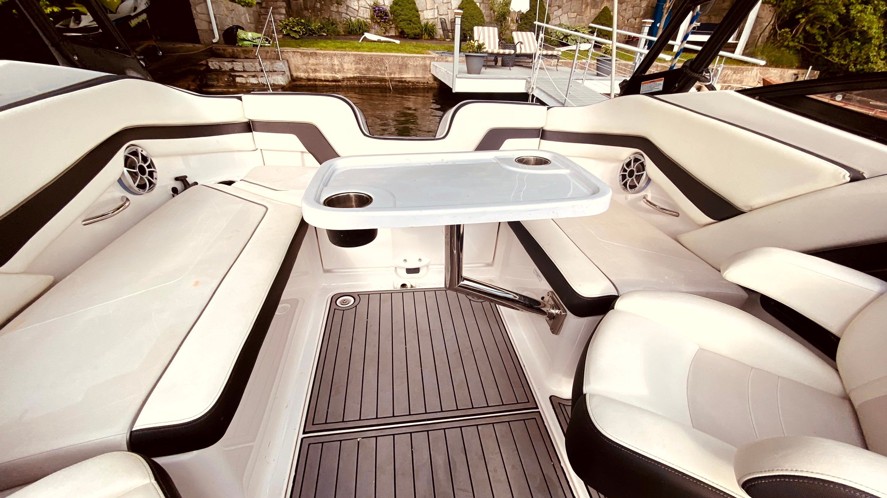 Interior of a 2016 Yamaha AR240 boat with table and seating.