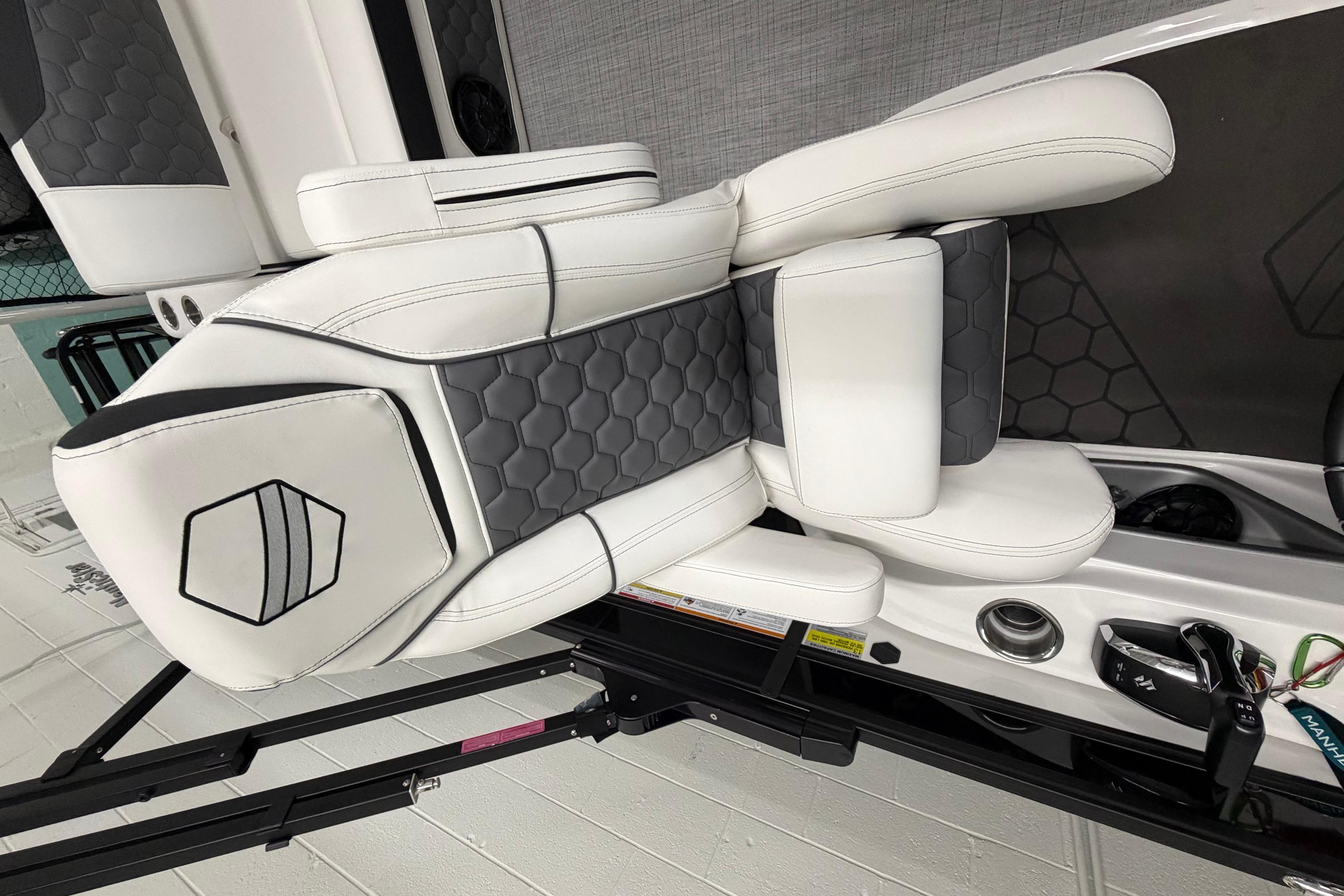 Luxurious white and gray seating in 2026 South Bay 525SB2 boat interior.