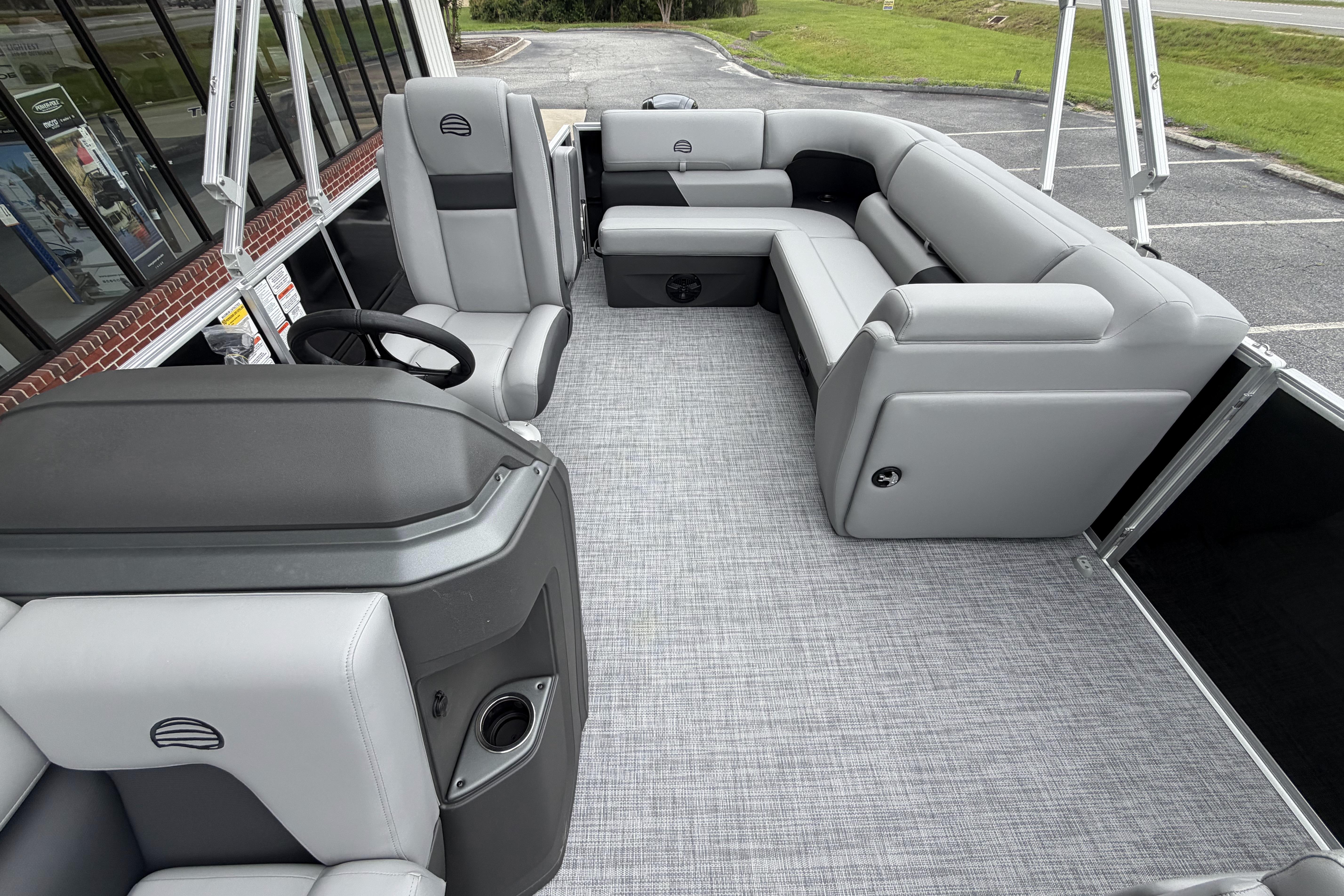 2026 Sun Tracker Party Barge 20 DLX interior with gray seating and modern design.