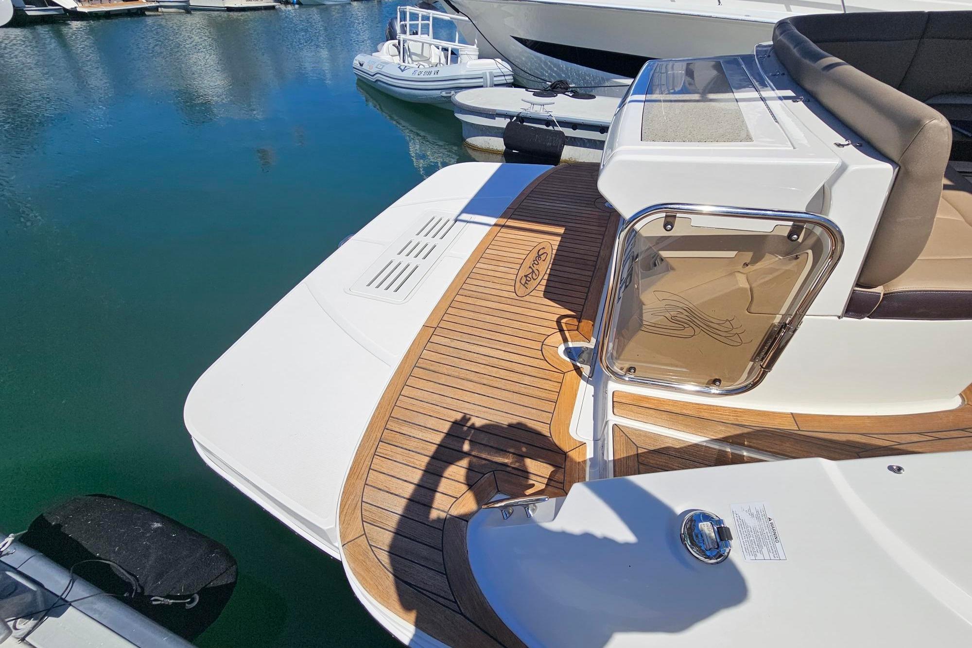 2016 Sea Ray Sundancer 350 yacht with teak deck at marina.