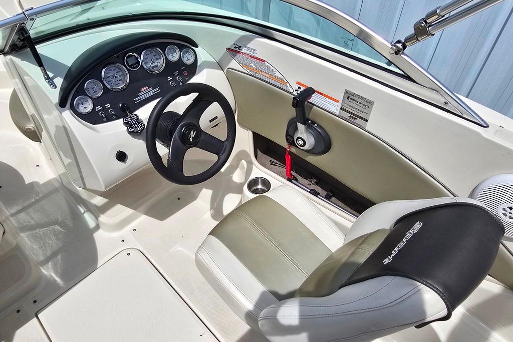 2006 Sea Ray 185 Sport boat interior with steering wheel and dashboard controls.
