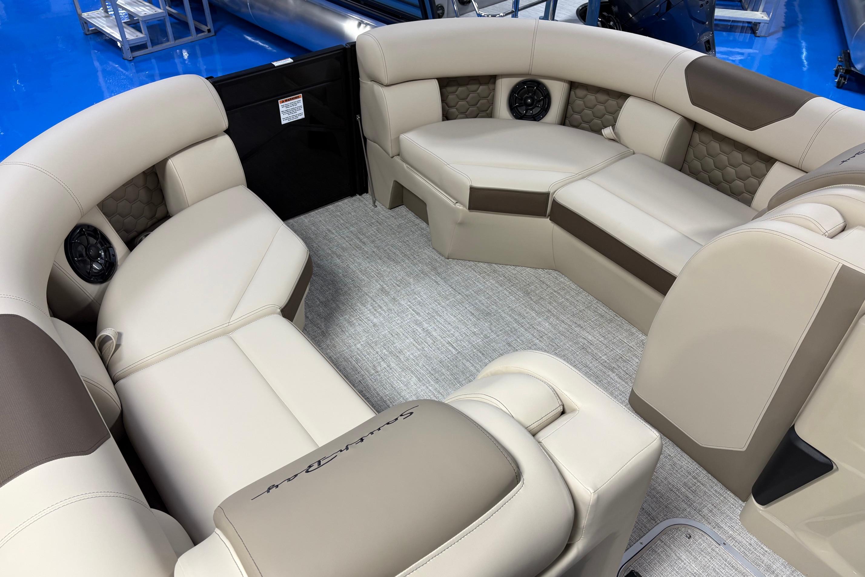 Luxurious interior of 2026 South Bay 523RS pontoon boat with plush seating and modern design.