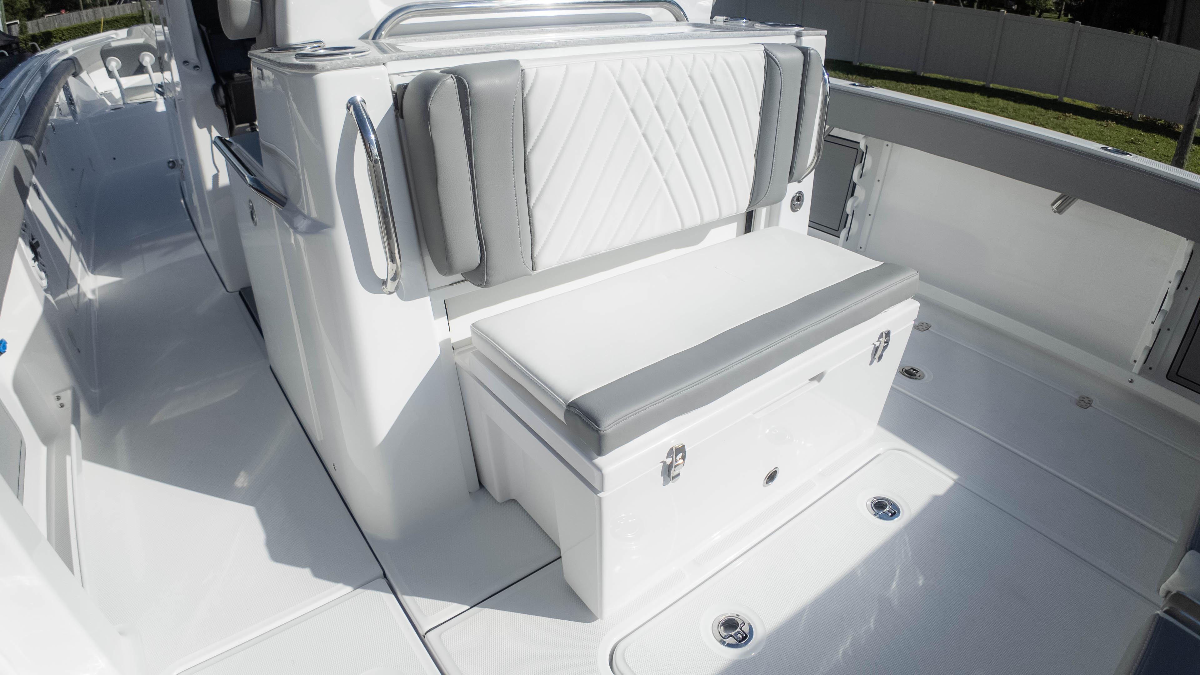 2025 Everglades 315 Center Console boat interior with cushioned seating and storage.