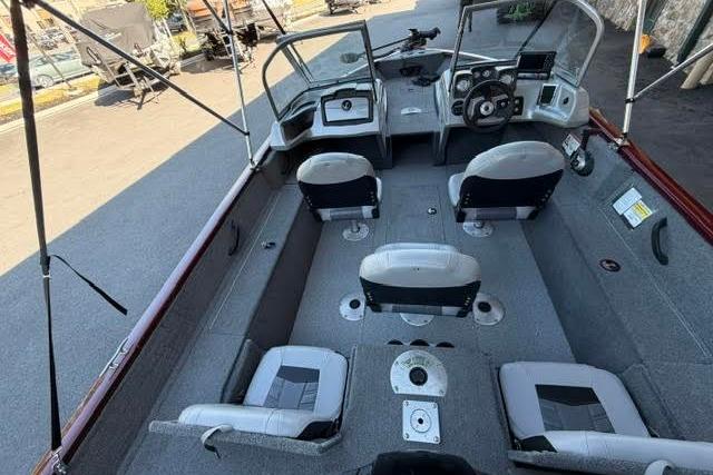 2017 Tracker Pro Guide V-175 Combo boat interior with seating and steering console.