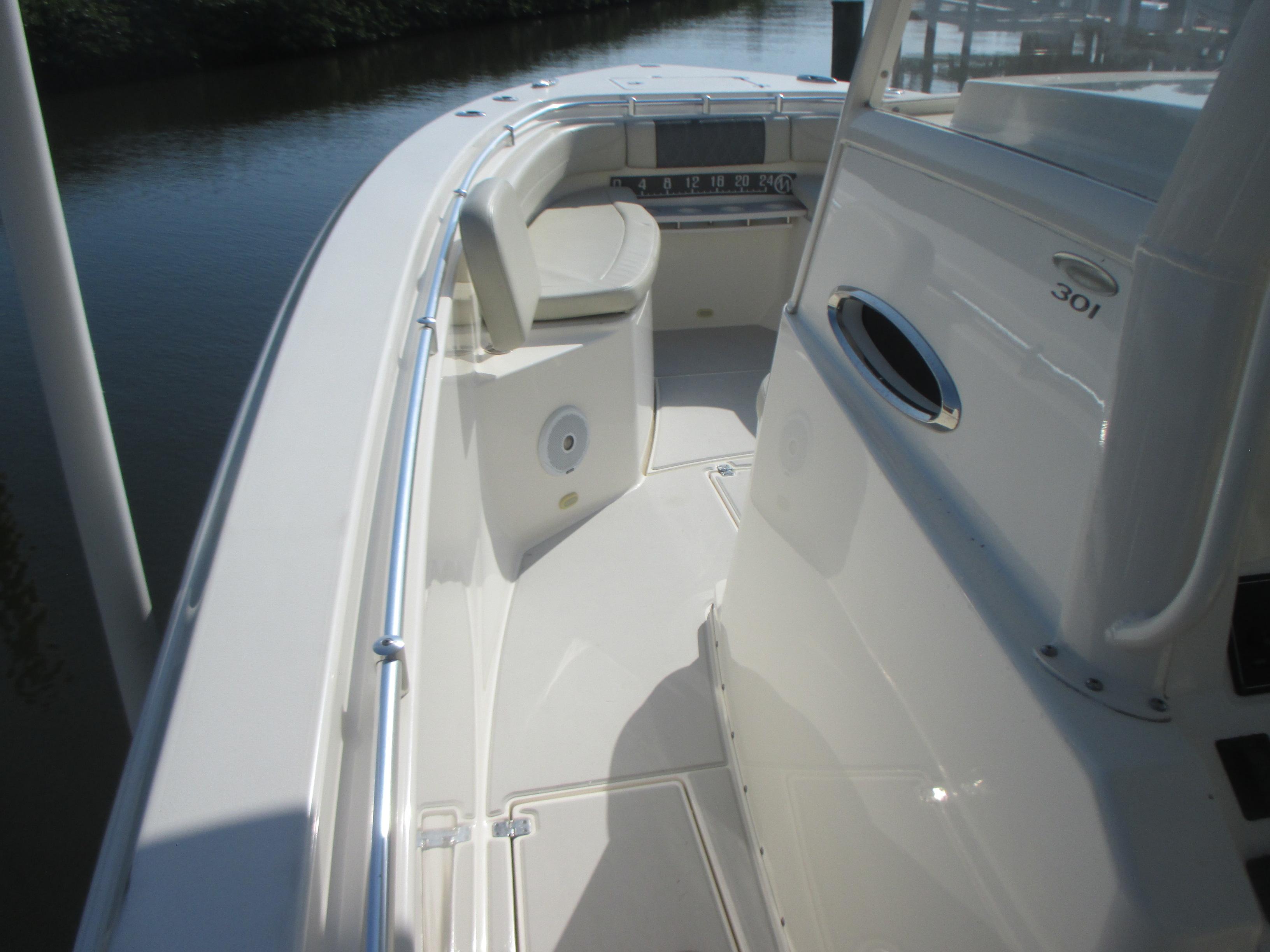 2018 Cobia 301 Center Console boat interior with seating and console view.