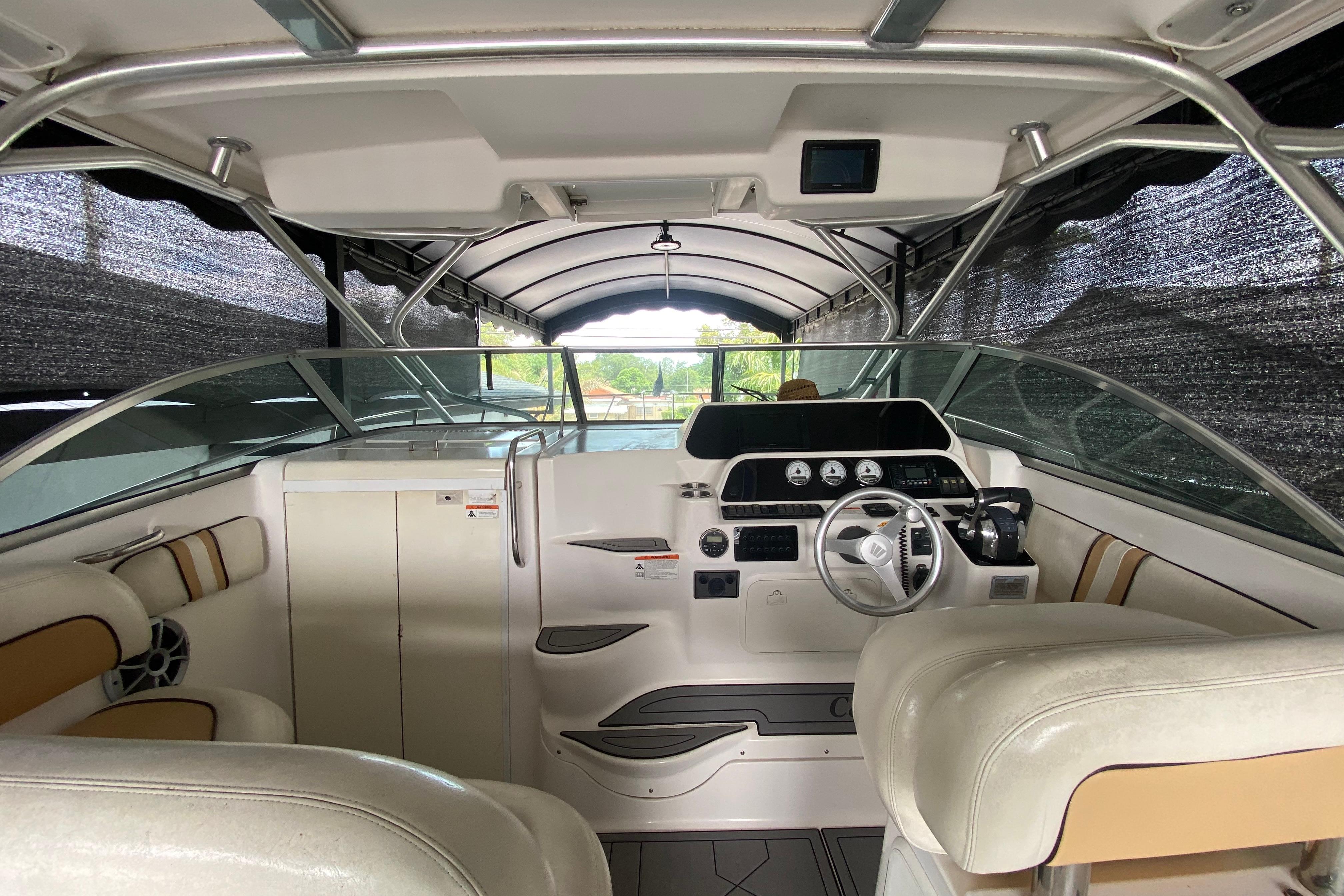 2005 Wellcraft 290 Coastal boat interior with steering wheel and dashboard controls.