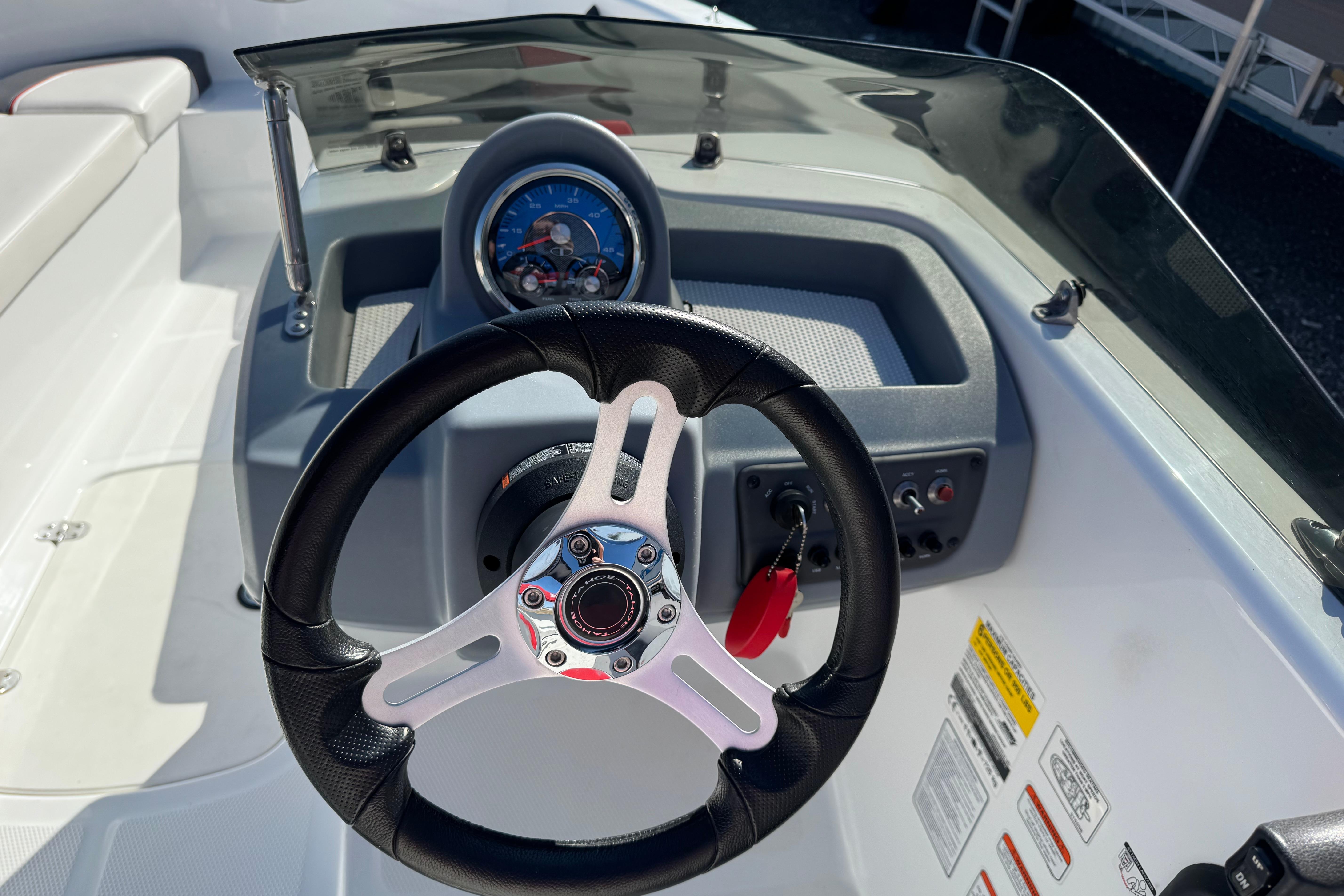 Steering wheel and dashboard of a 2021 Tahoe T16 boat.