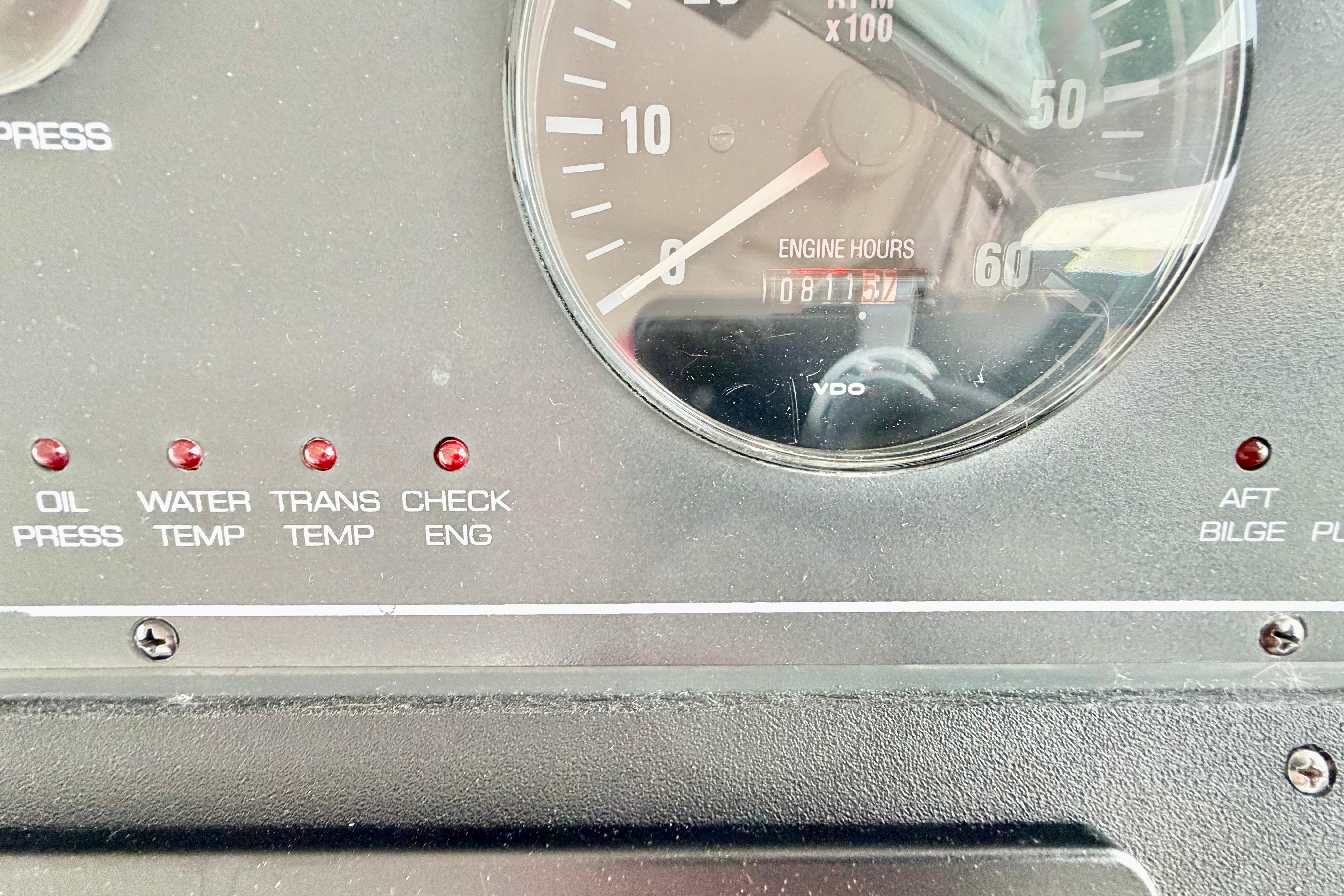Instrument panel of a 1999 Tiara Yachts 2900 Coronet showing engine hours and warning lights.