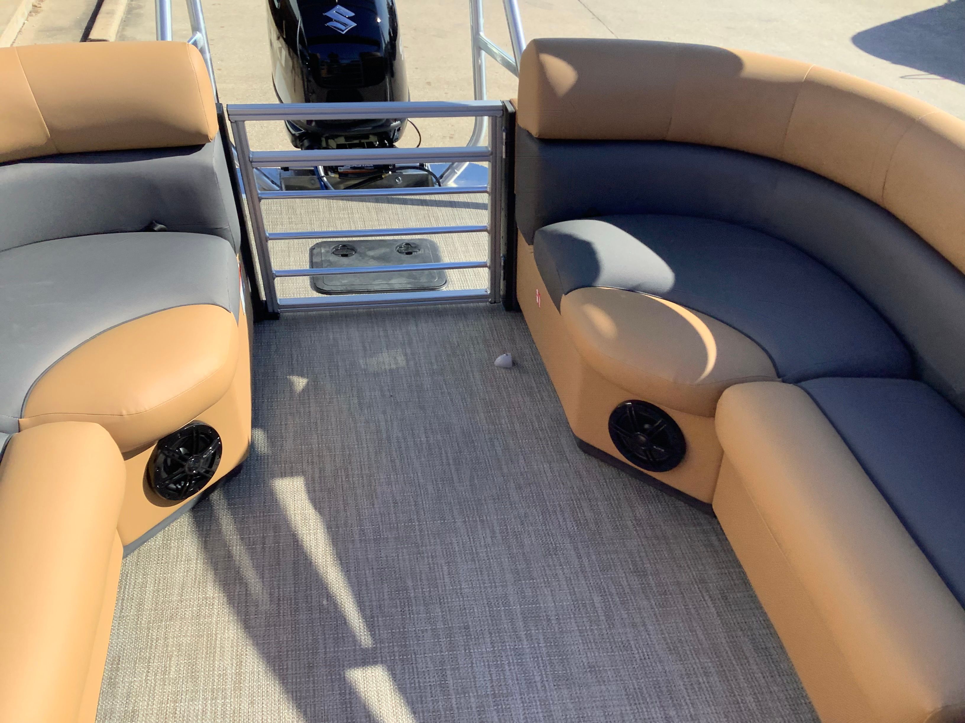 Interior of 2026 Landau 21 Island Breeze with beige and gray seating.