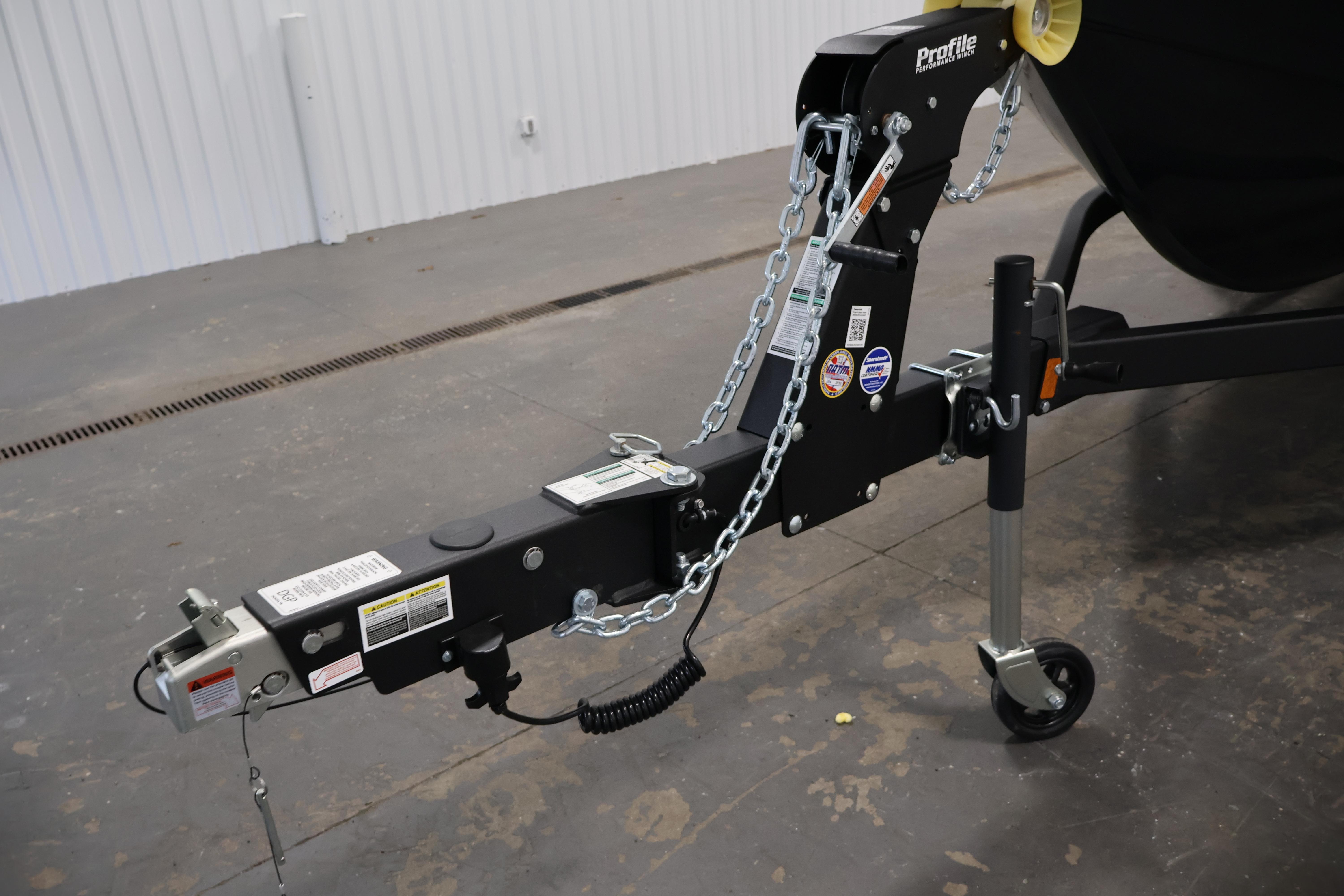 Trailer hitch of 2026 Crestliner 1850 Kodiak SC boat, featuring secure chains and wheel support.