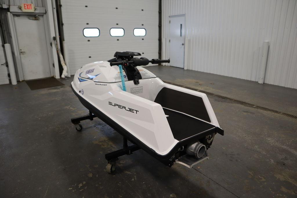 2025 Yamaha WaveRunner SuperJet in a garage, showcasing sleek design and advanced features.