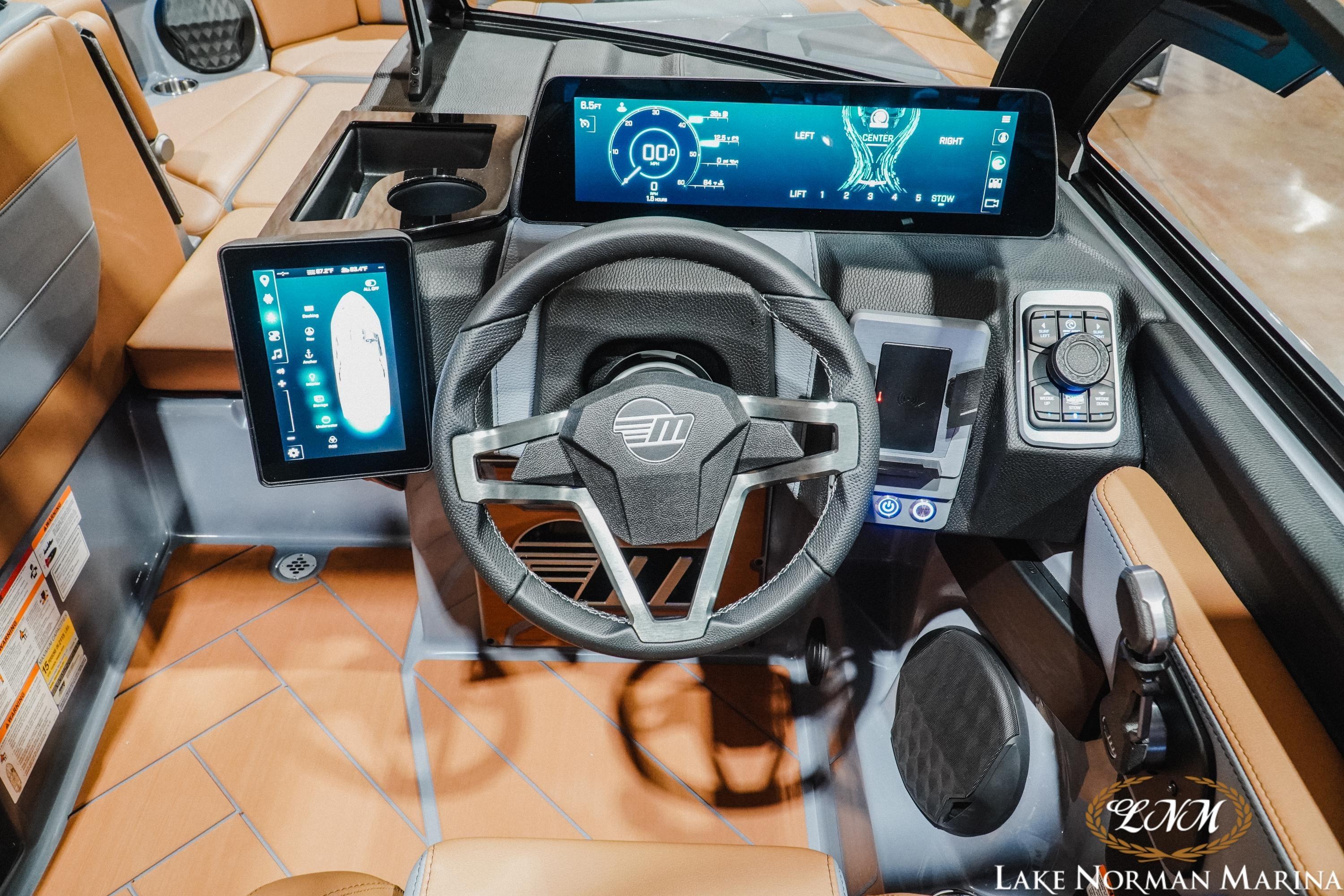 2026 Malibu Wakesetter 23 LSV dashboard with advanced digital displays and modern steering wheel.