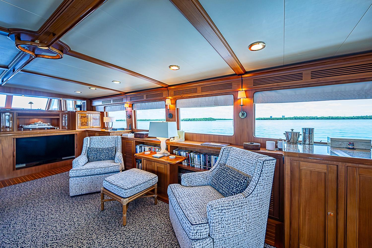 Luxurious interior of 2014 Marlow 80 Explorer yacht with elegant seating and scenic views.