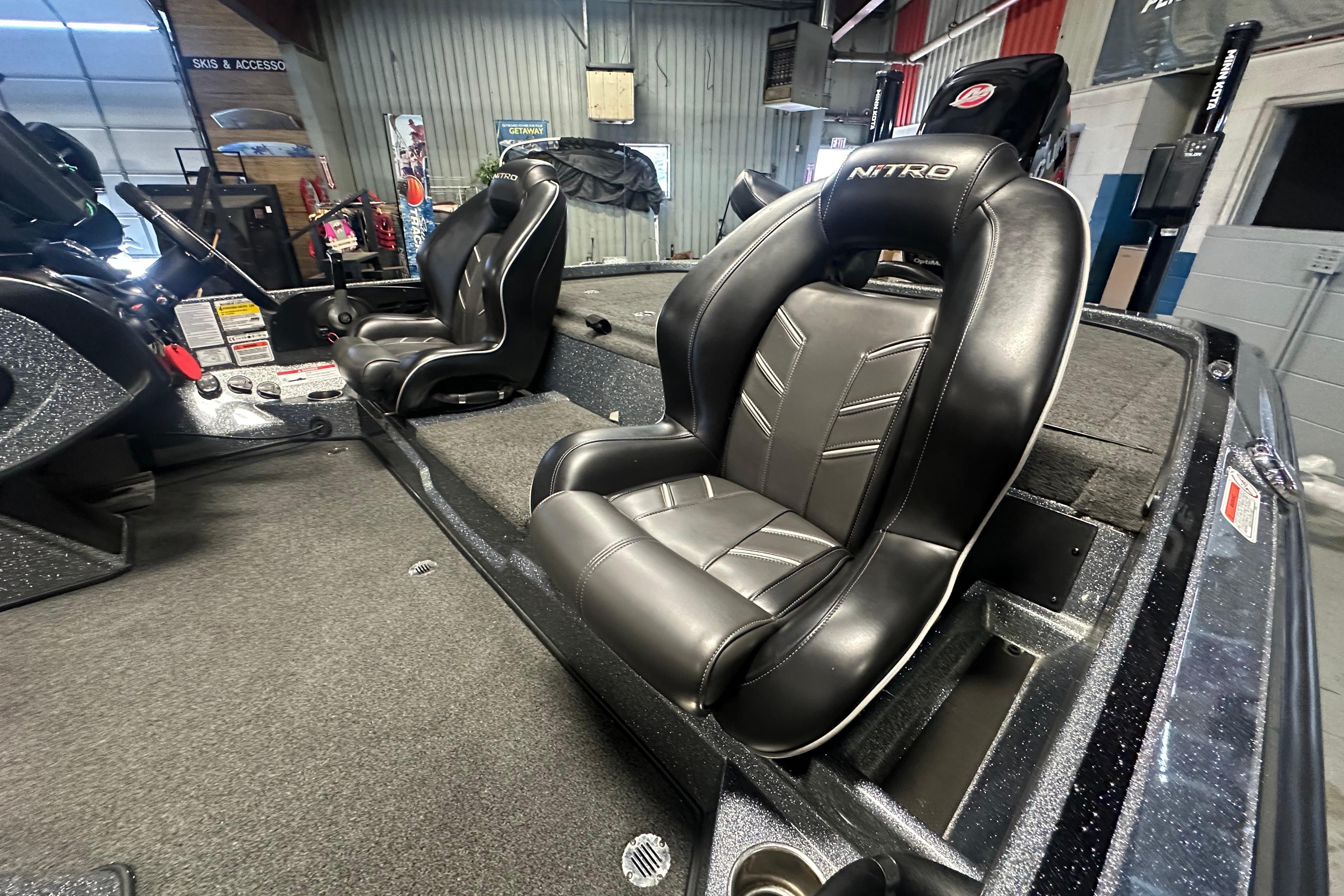 Interior of a 2018 Nitro Z20 Pro boat featuring sleek black leather seats.